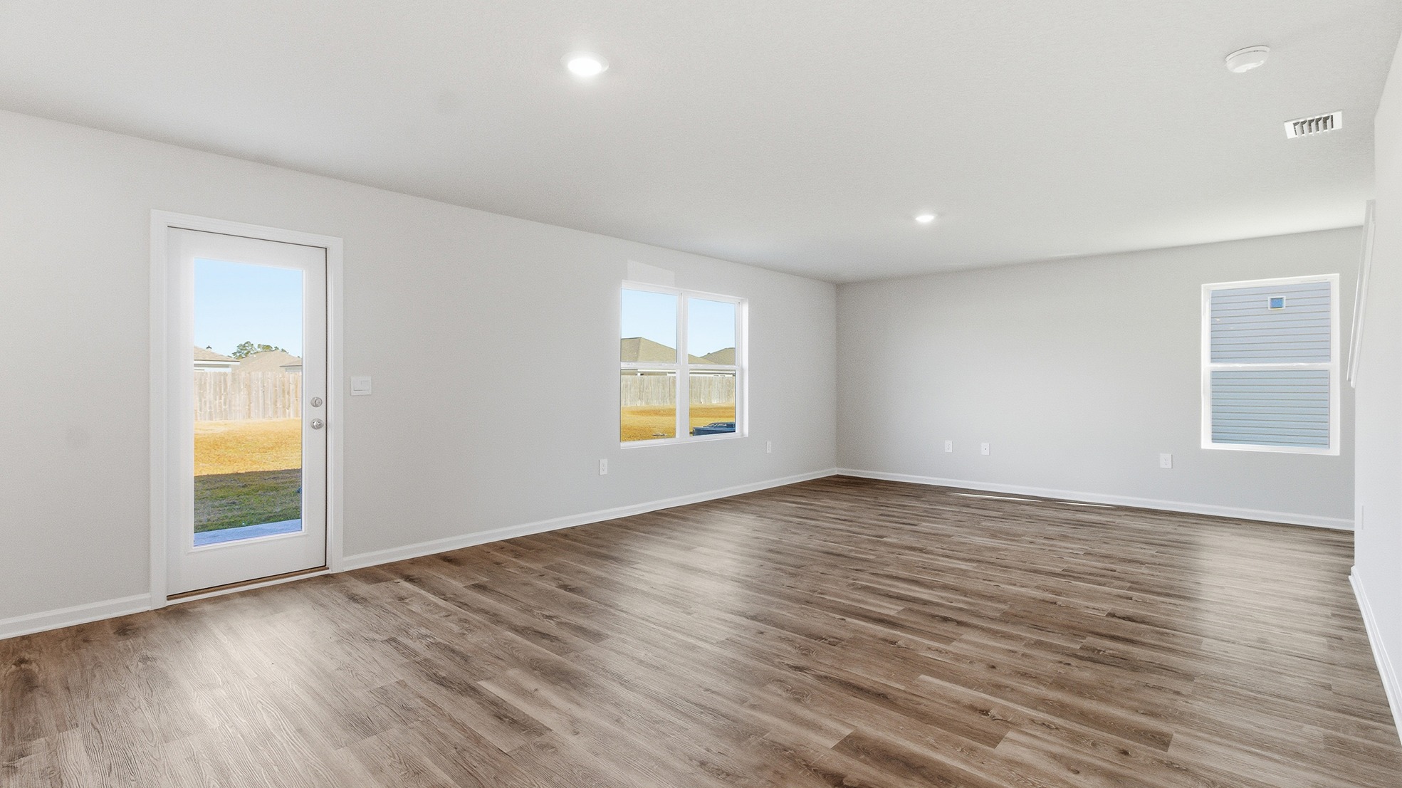 The open concept of the living room creates a bright airy feel