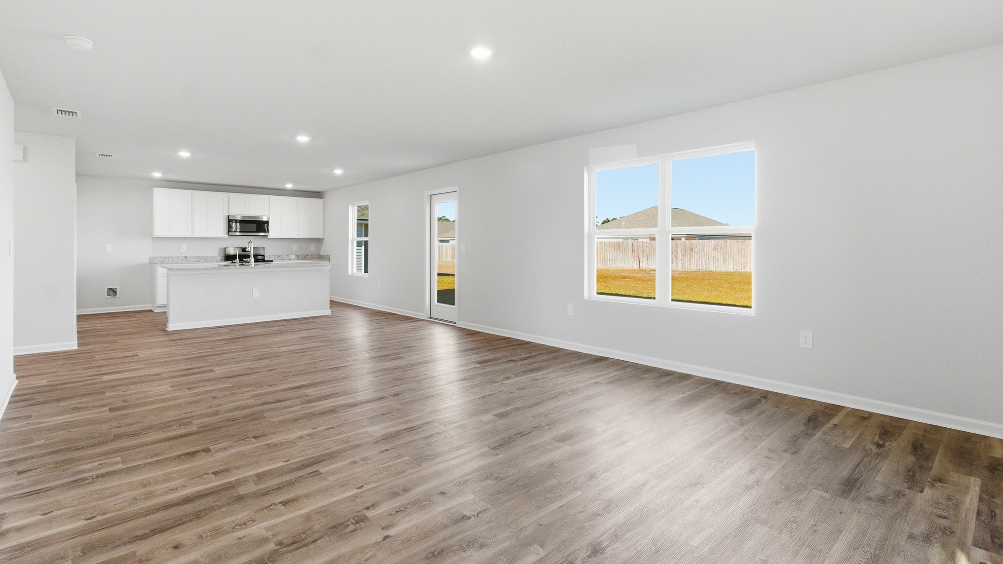 The kitchen looks out to the living area