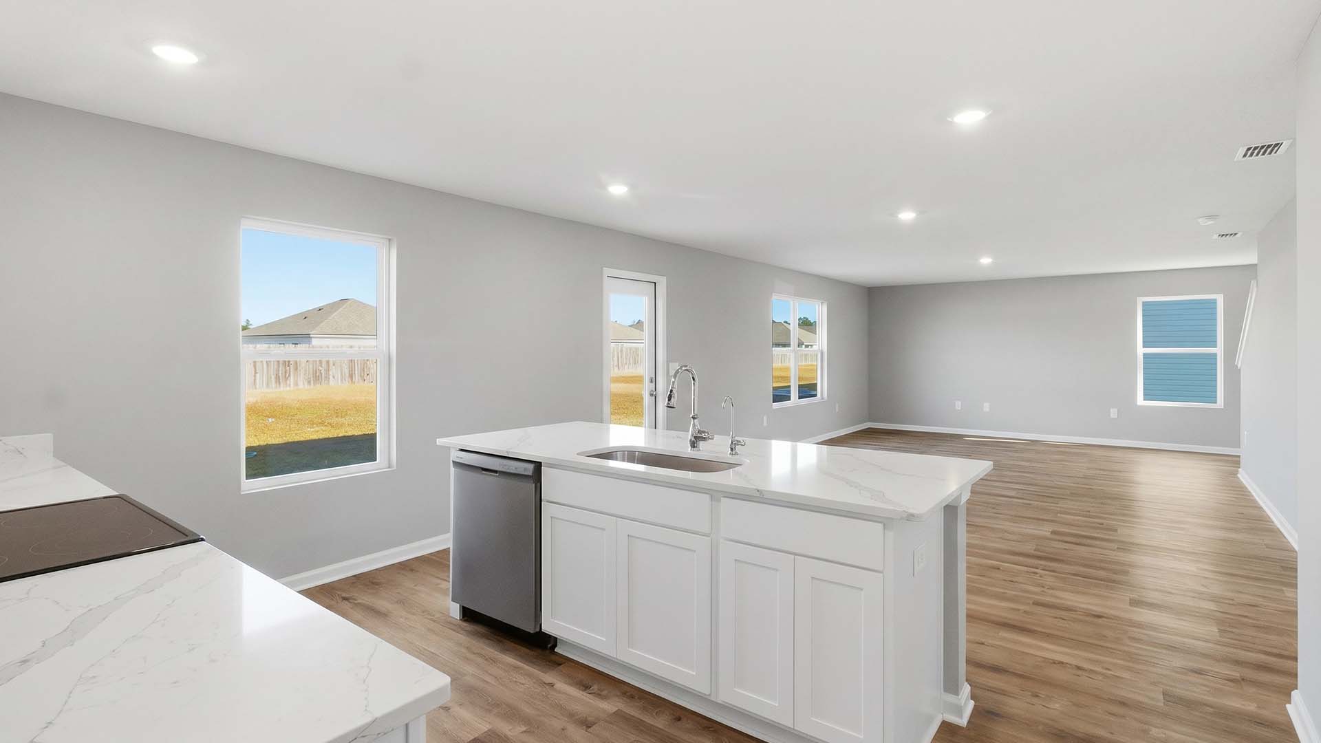 A dishwasher and sink at the center island allow for easy meal prep, service and clean up