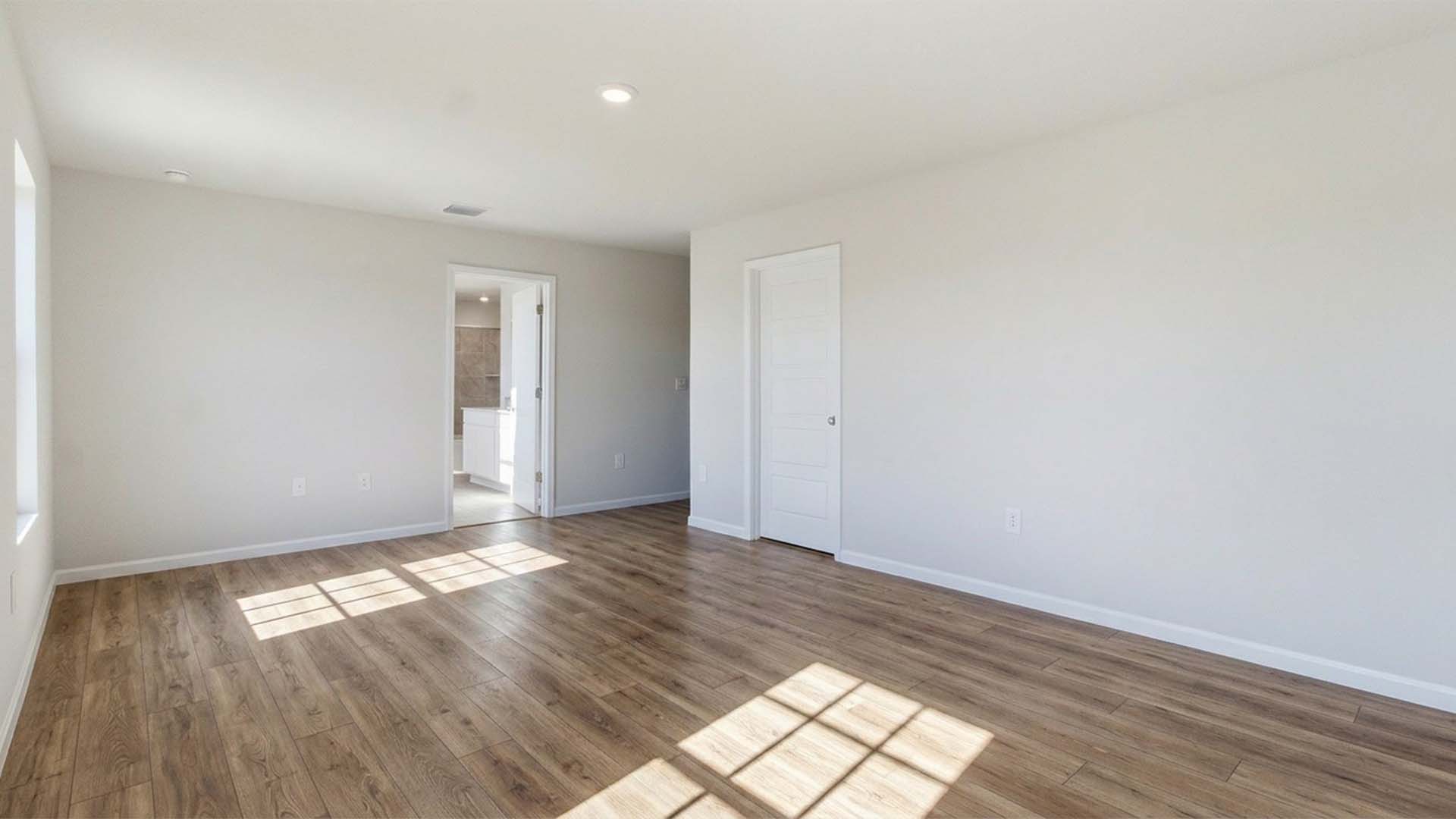 The primary bedroom has EVP flooring and a private ensuite bathroom