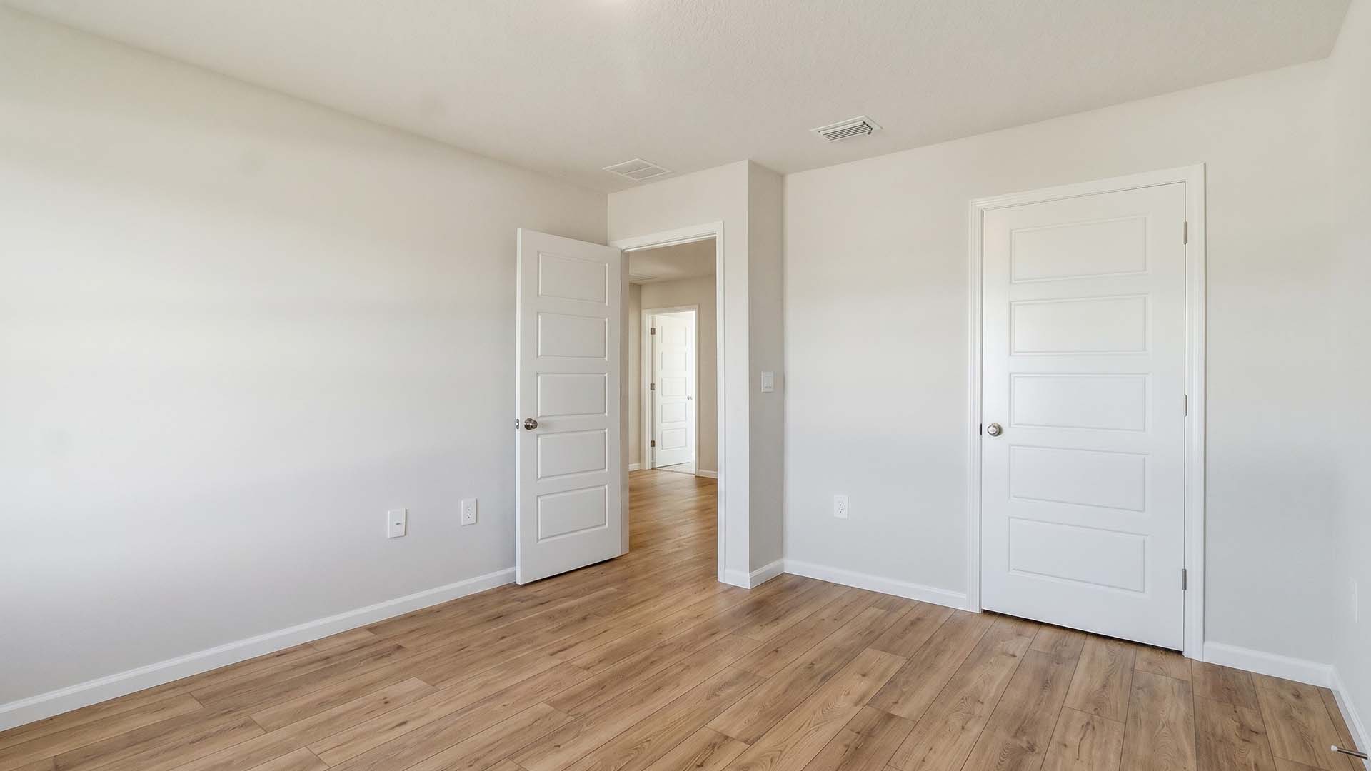 Guest bedroom one has EVP flooring