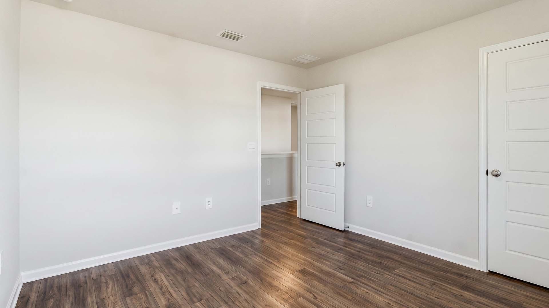 Guest bedroom three has EVP flooring