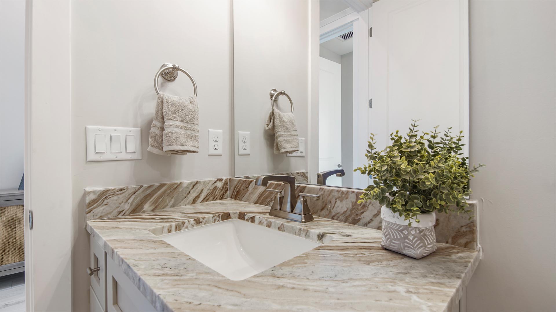 Bathroom two with single vanity with quartz countertops and undermount sink.