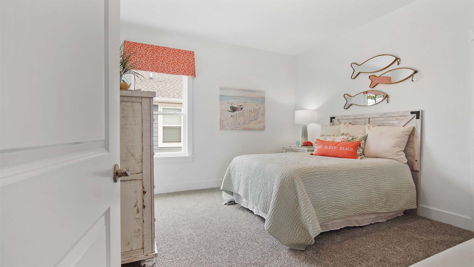 Bedroom two with carpet flooring and a window.