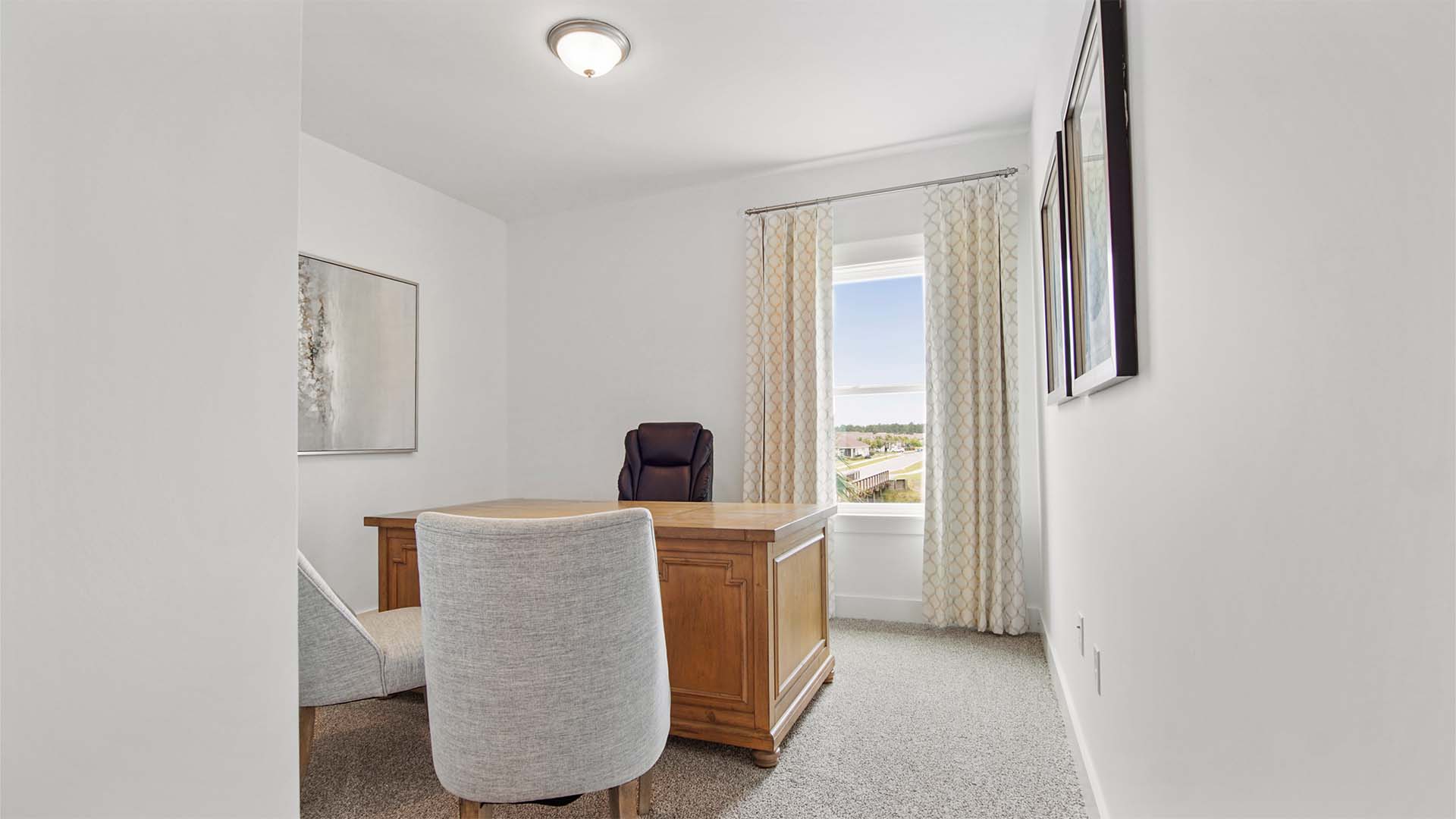 Bedroom four with carpet flooring and a window.
