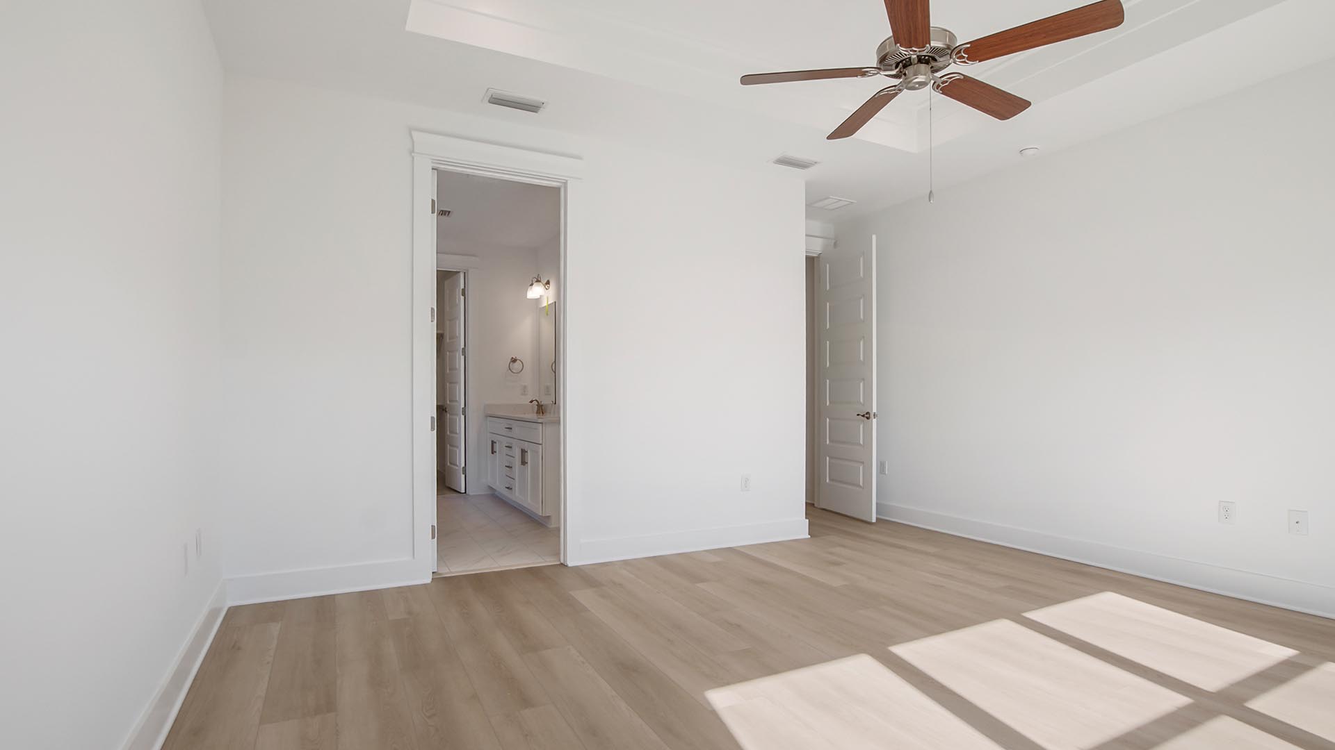 The primary bedroom has a private ensuite bathroom