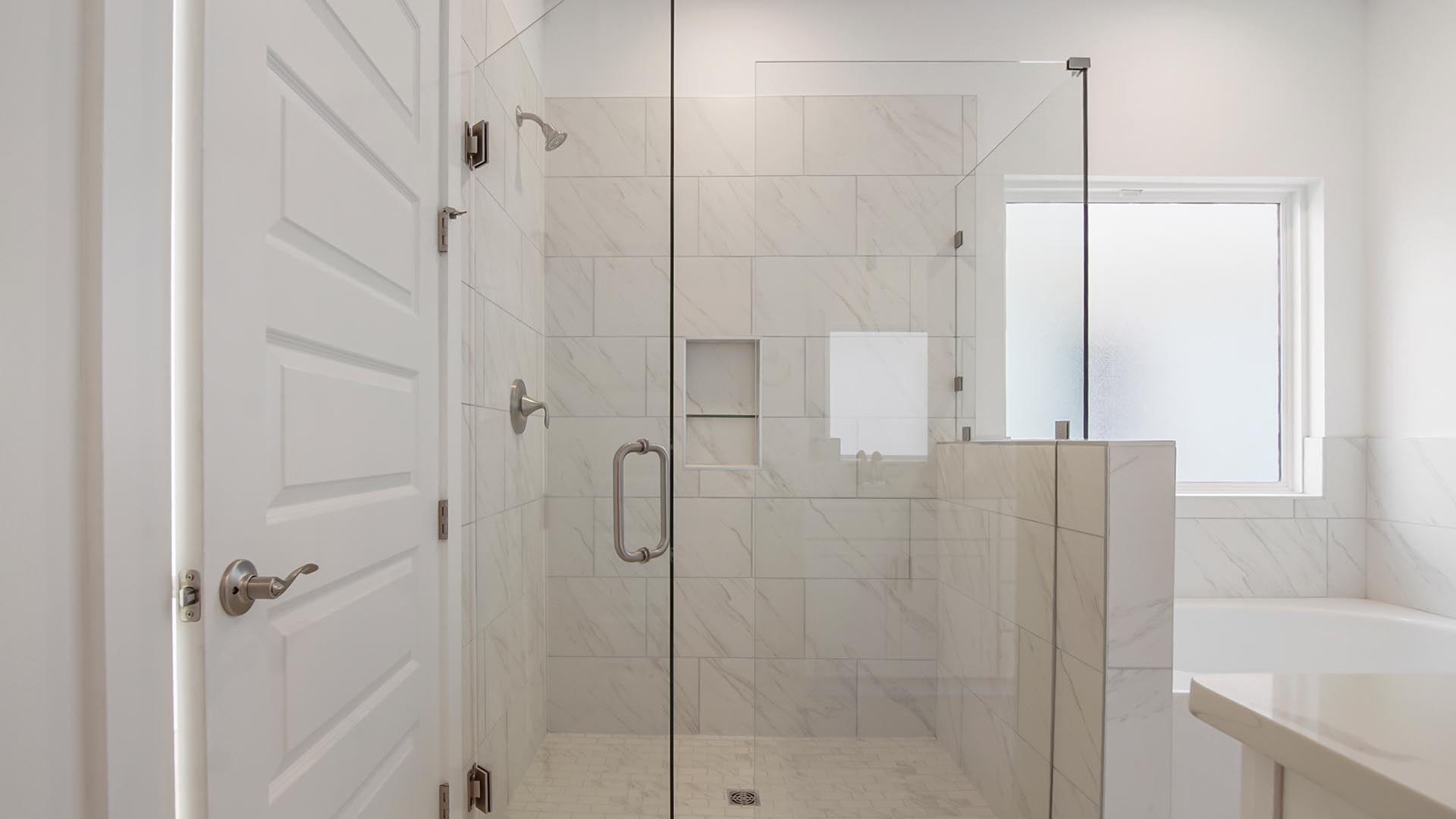 The primary bathroom has a luxurious shower