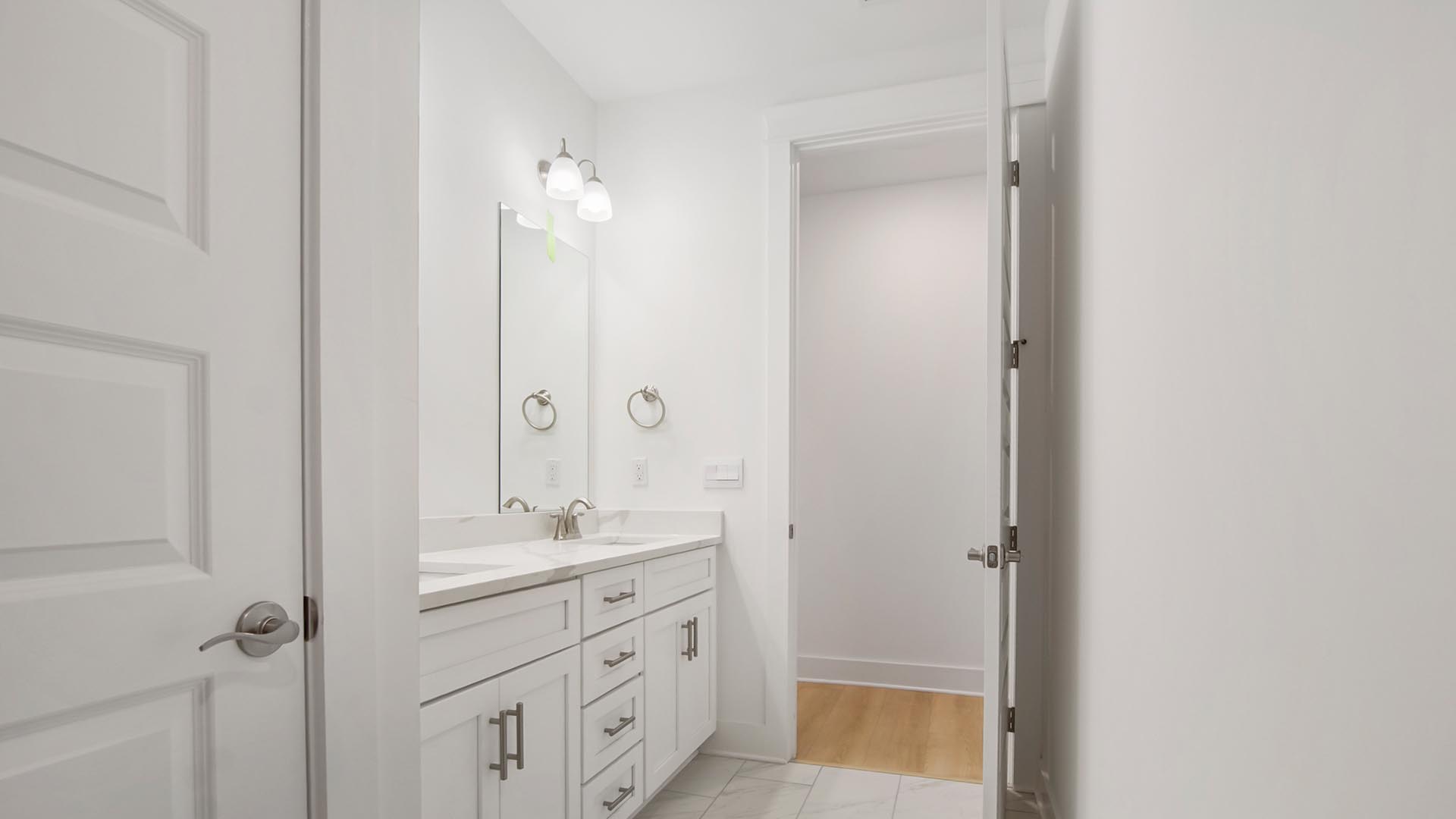 Full bathroom with linen storage area