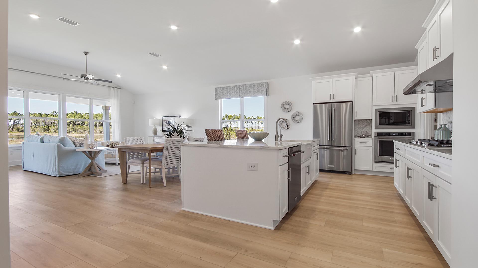 The grand living area features beautiful EVP flooring and showcases a gourmet style kitchen