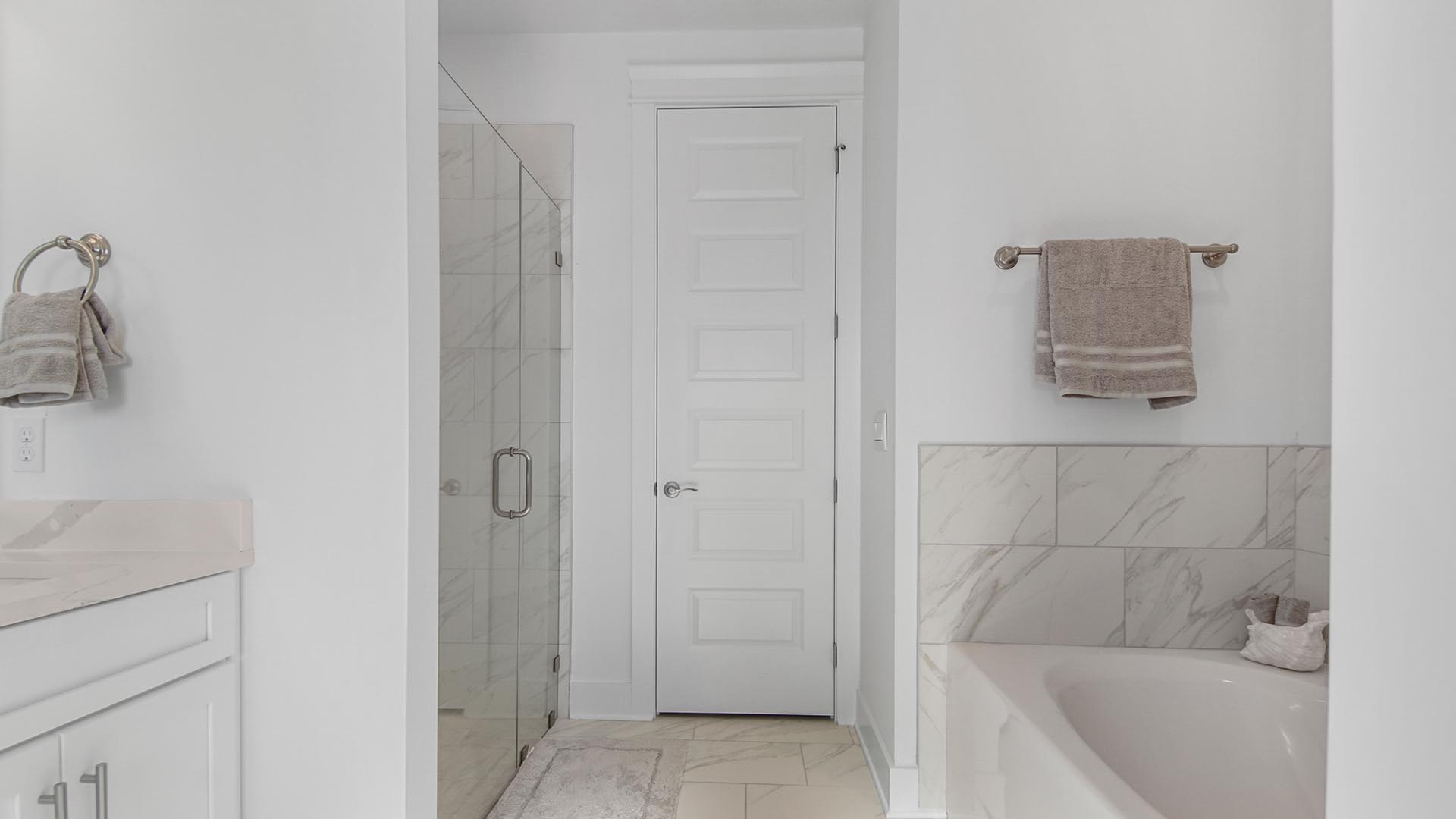 The large soak tub is elegantly designed with a tile wall and allows for long soaks after your day