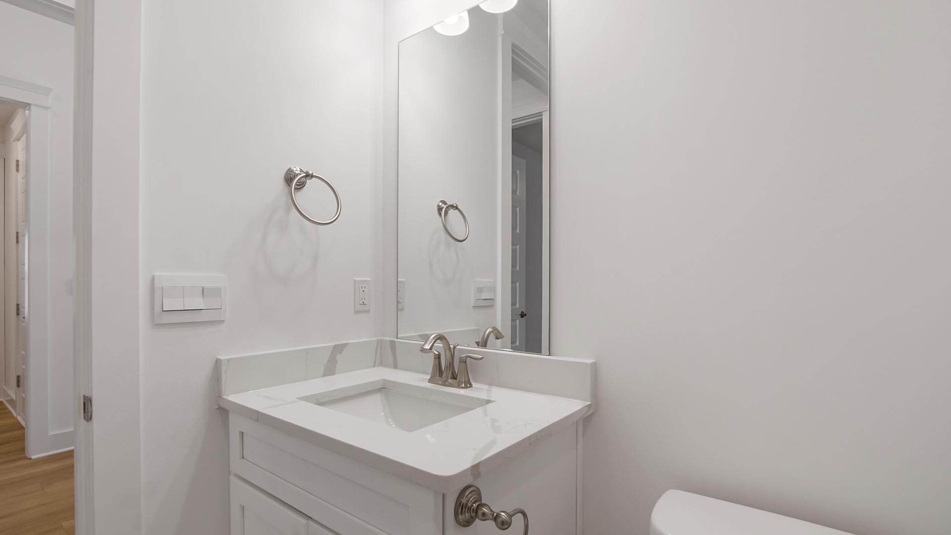 The shared bathroom and quartz countertop and single vanity
