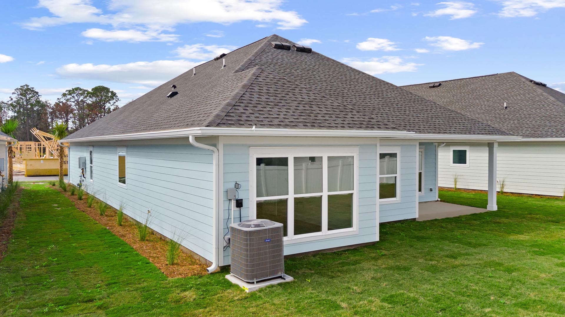 Expansive windows are along the back of the home allowing for natural light
