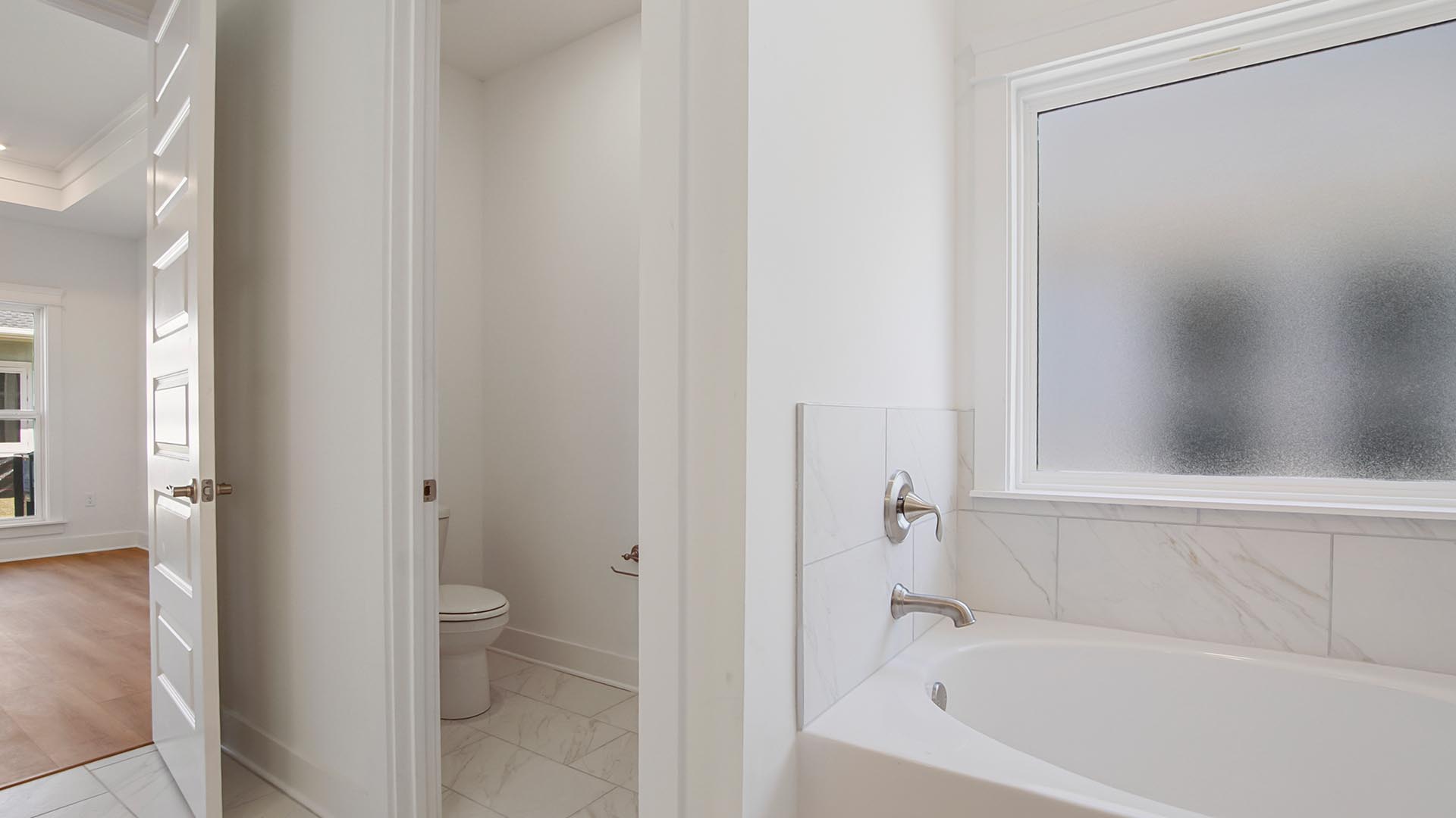 There is a separate water closet in the primary bath for privacy