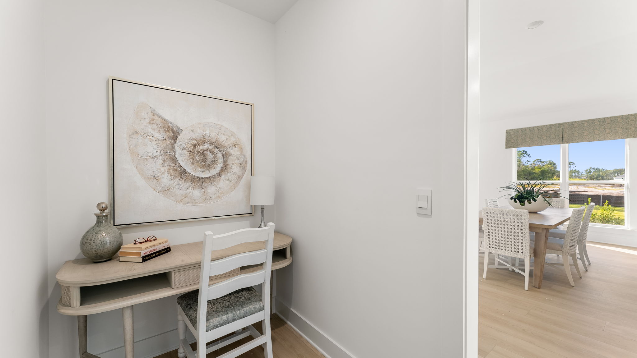 There is a nook for a work station or folding area off the laundry room