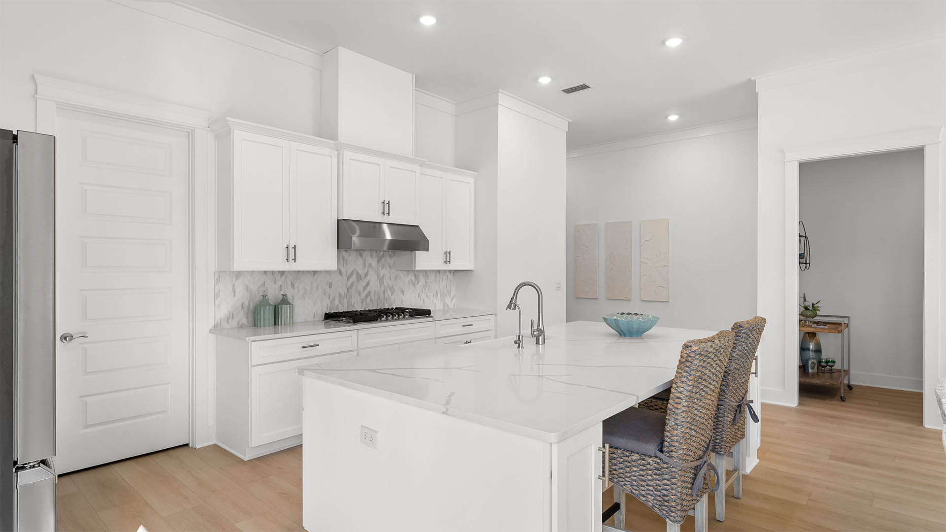 The center island has quartz countertops and space for bar seating