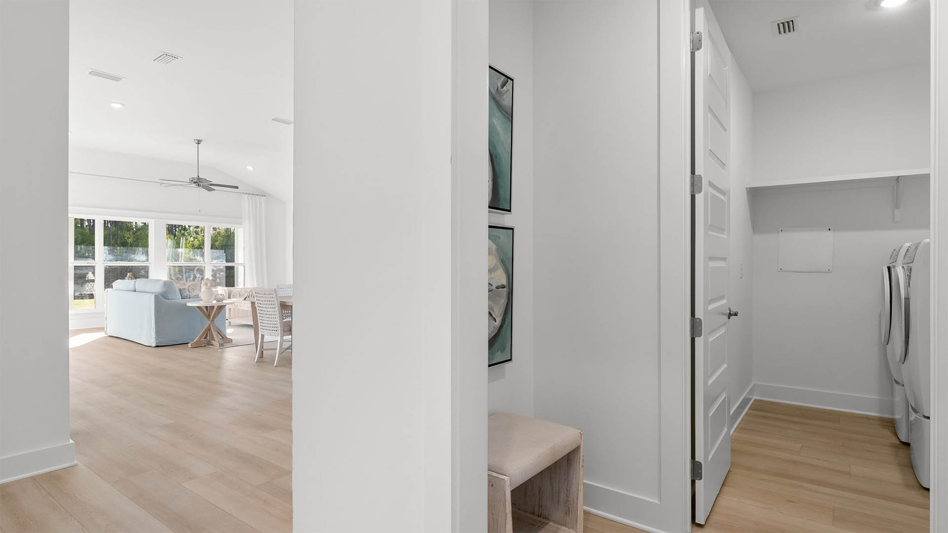 The laundry room is located adjacent to the kitchen