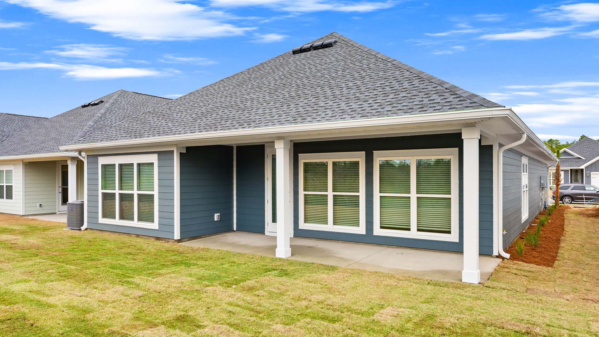 There is a covered patio at the back of the home with space for a dining and lounging area