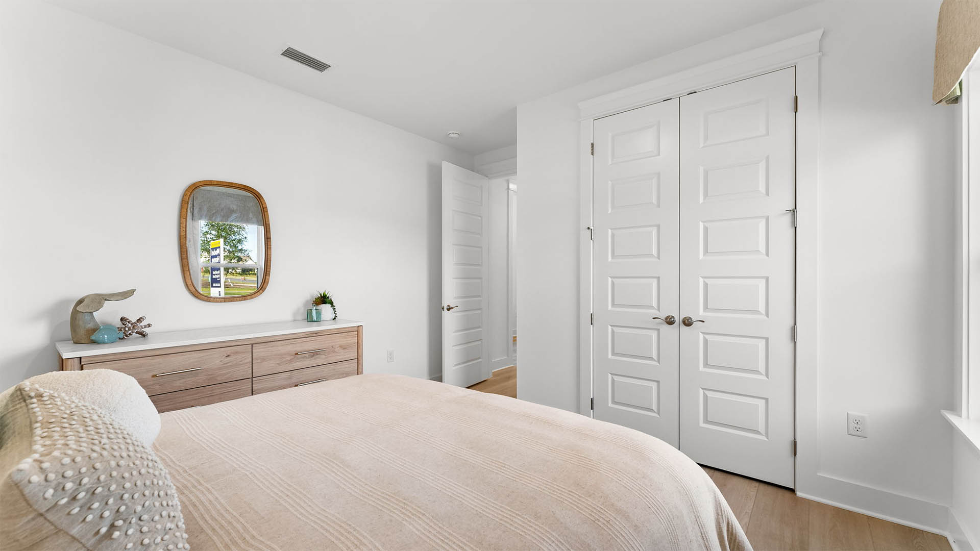 Guest bedroom one has carpet and ample closet space