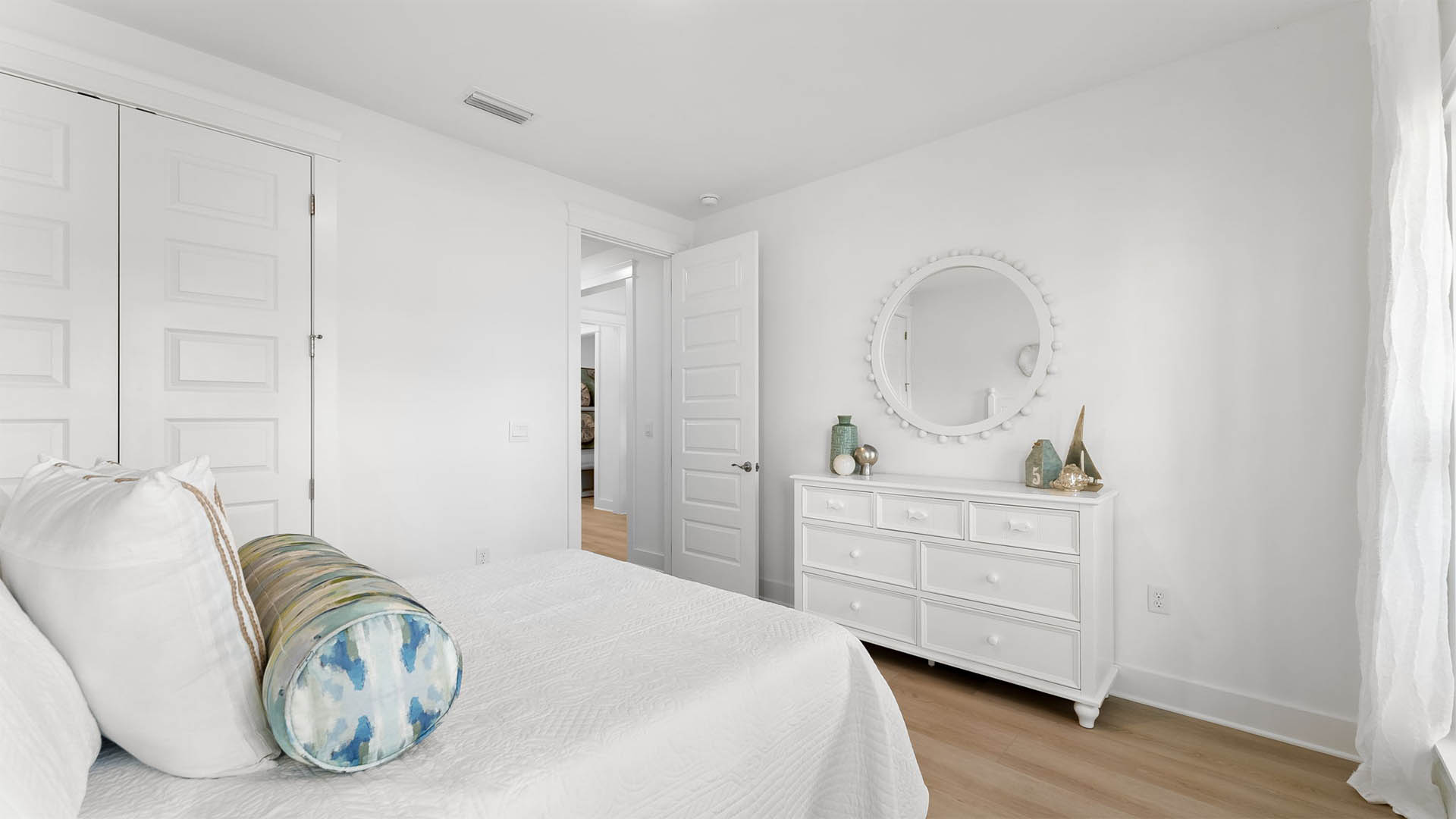 Guest bedroom two has carpet and ample closet space