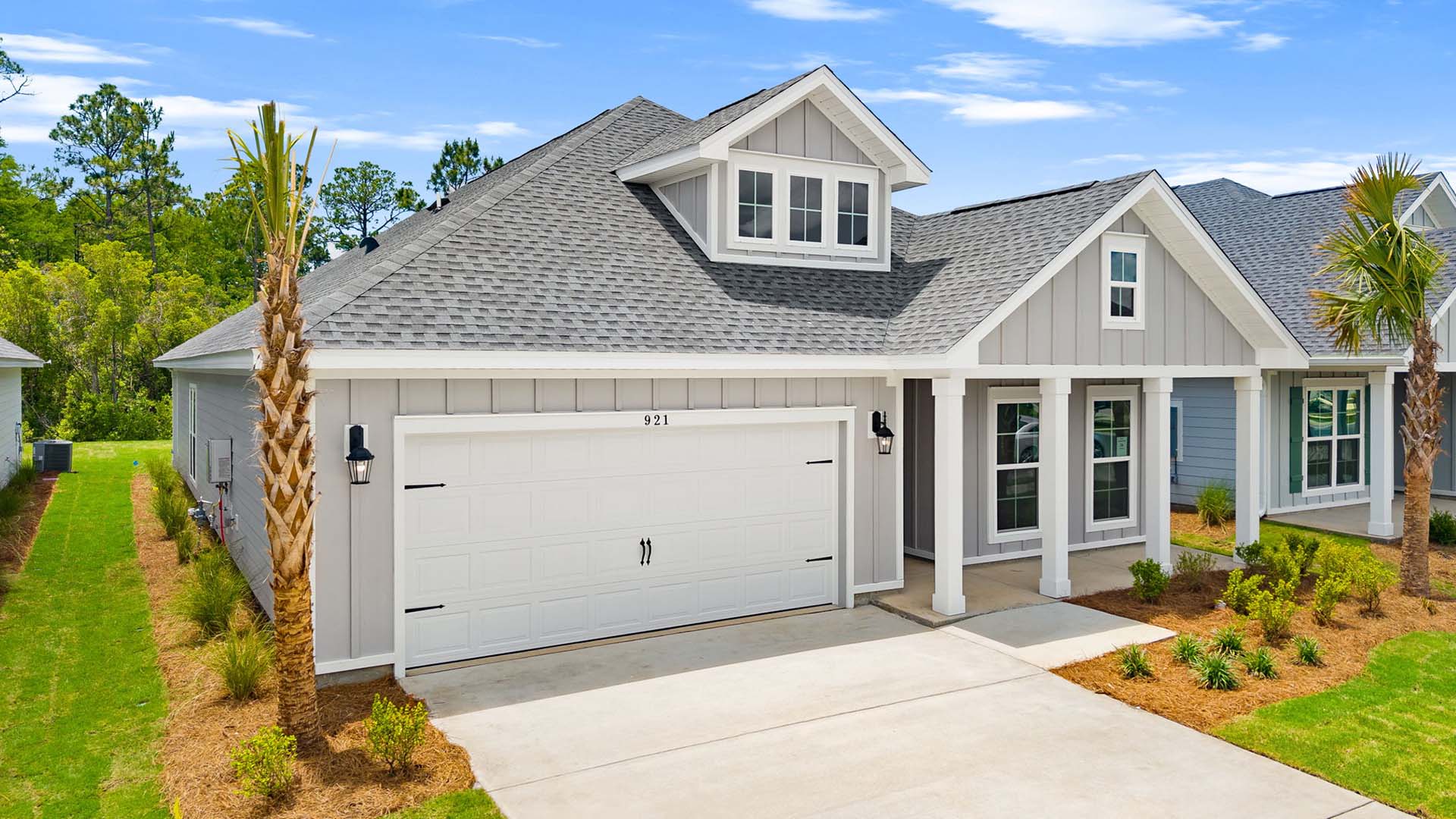 This home has a covered front patio and a two car garage
