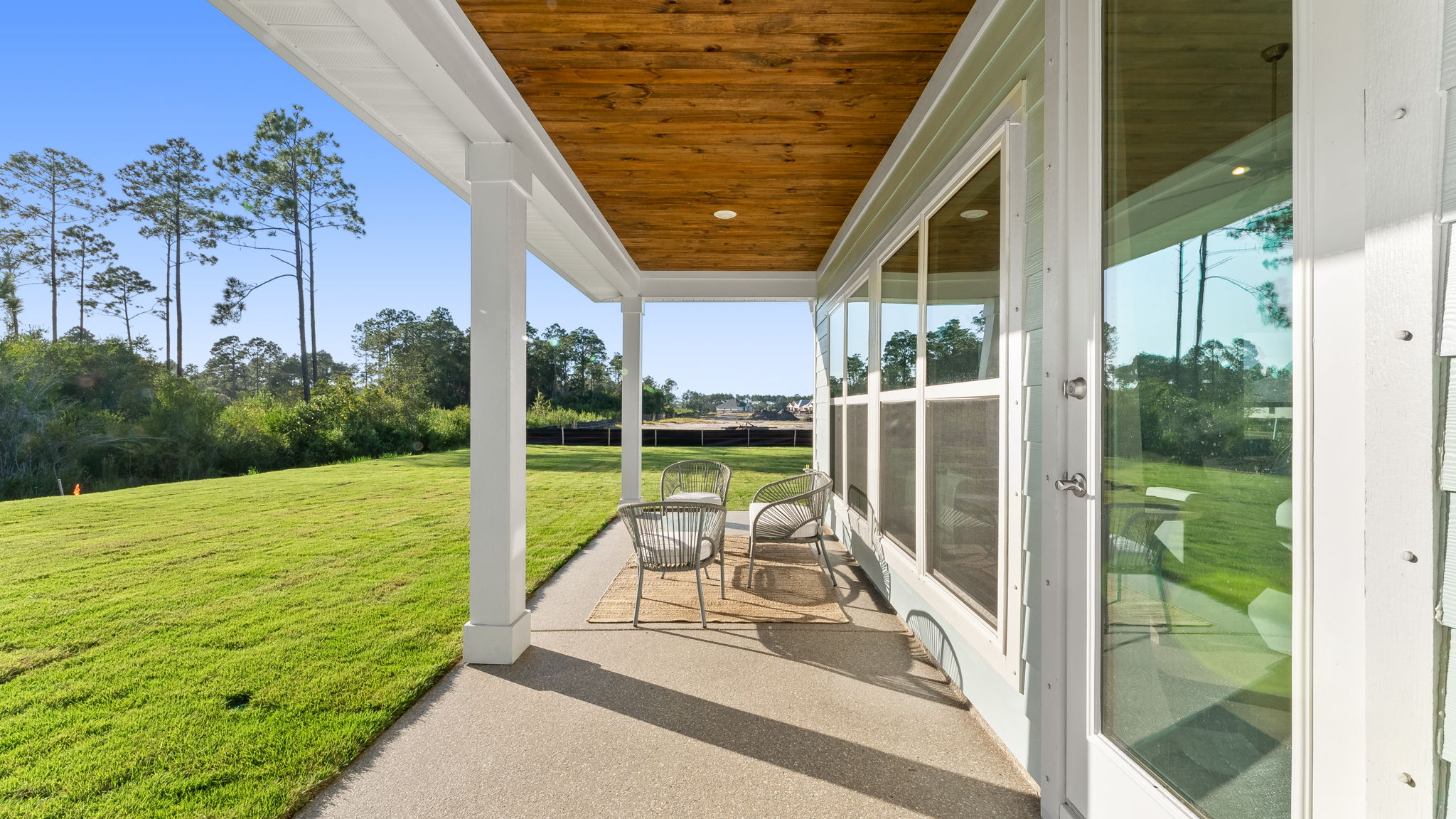 The covered back patio has space for dining or sitting area