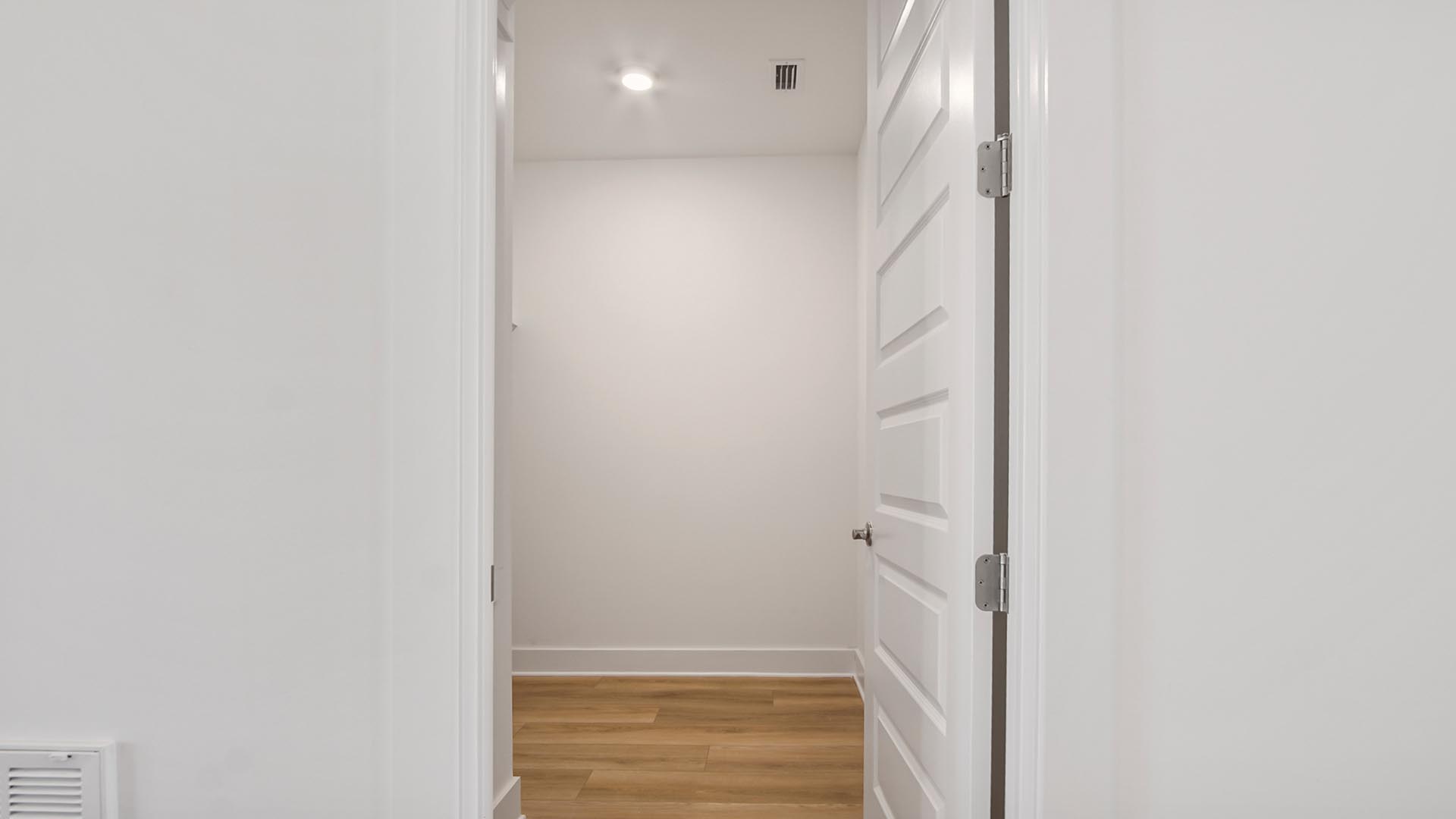 The laundry room has space for a full size washer and dryer