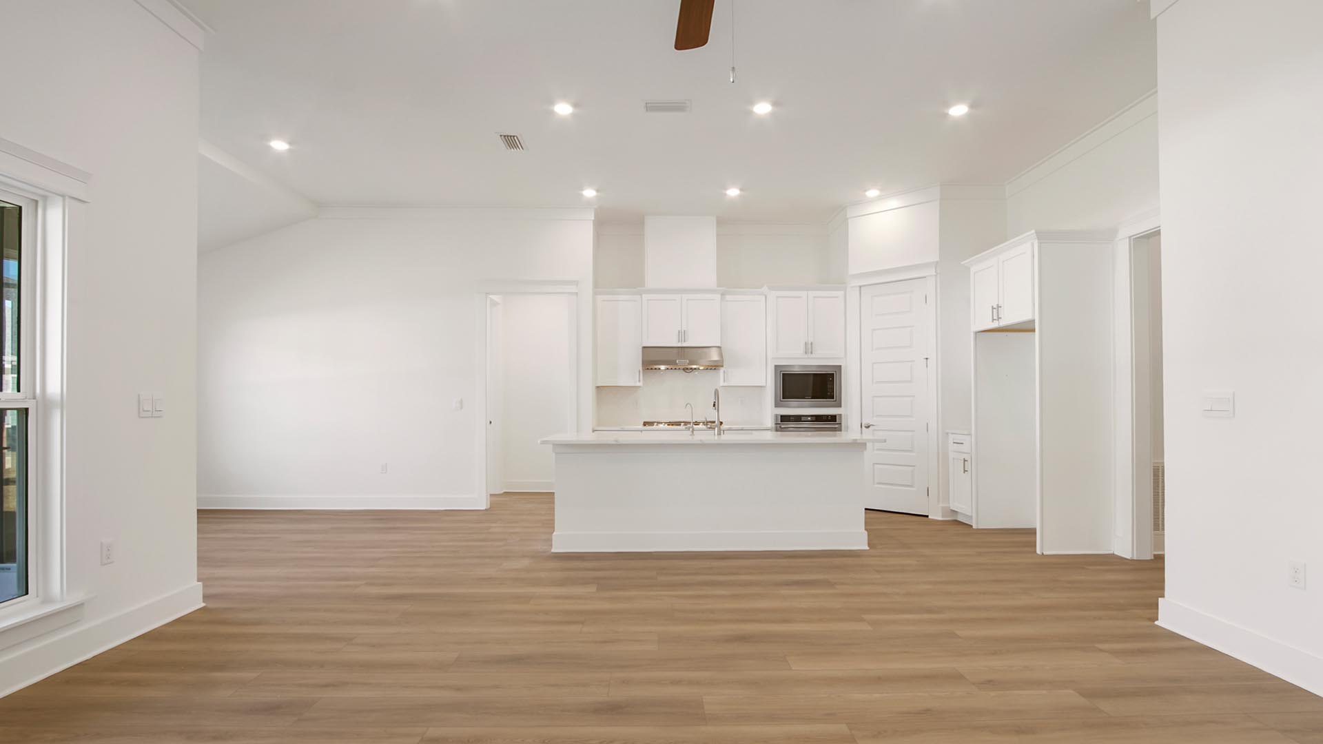 The kitchen is open to the living and dining area