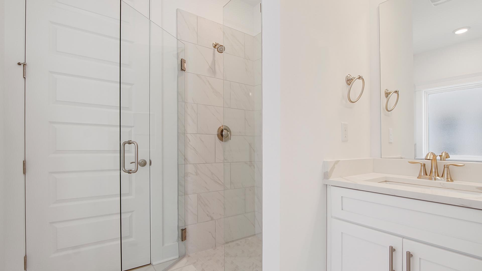 A separate shower offers a spa like feel with tile and glass enclosure