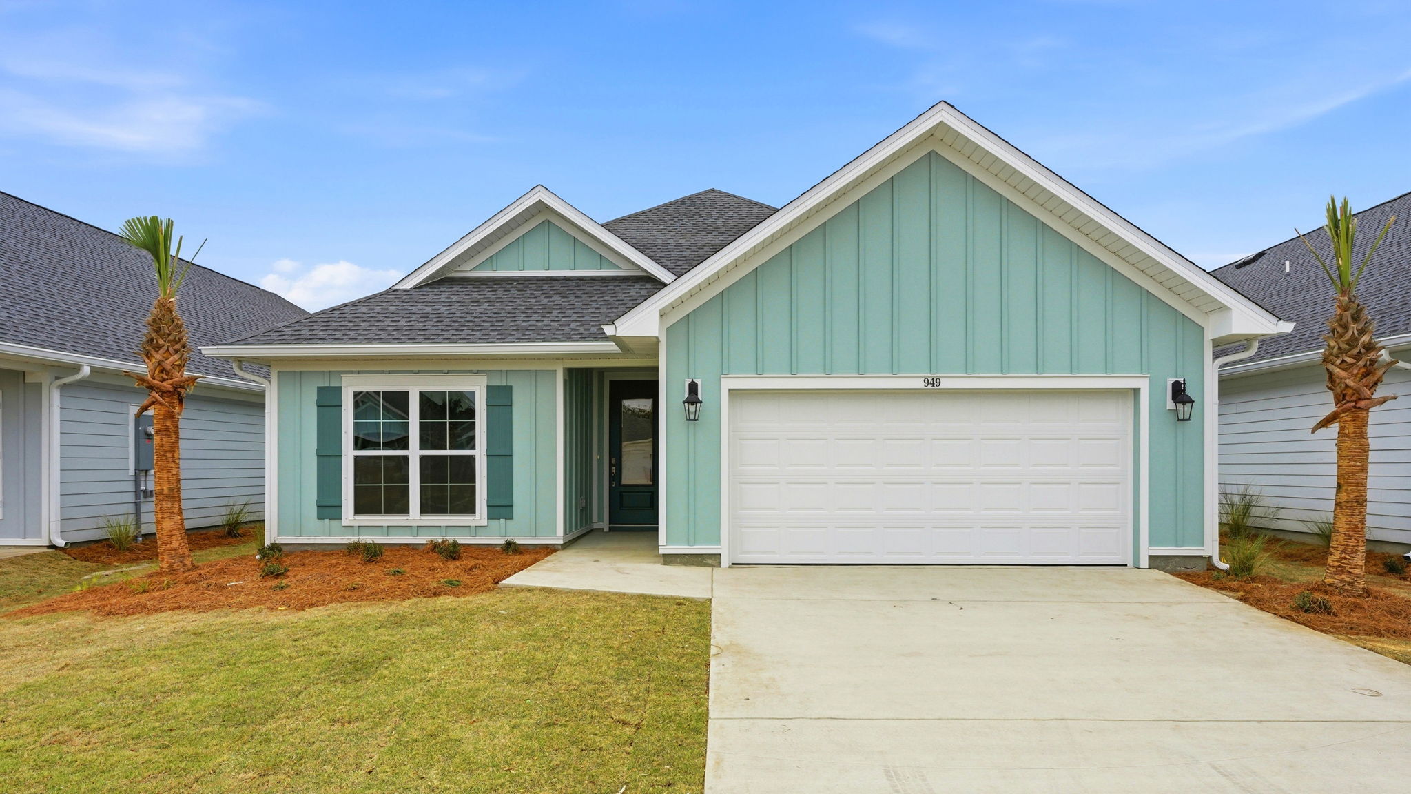 949 Crystal Bayou Boulevard is ready for move in. The Hardie exterior is a mint green and there is a covered front patio