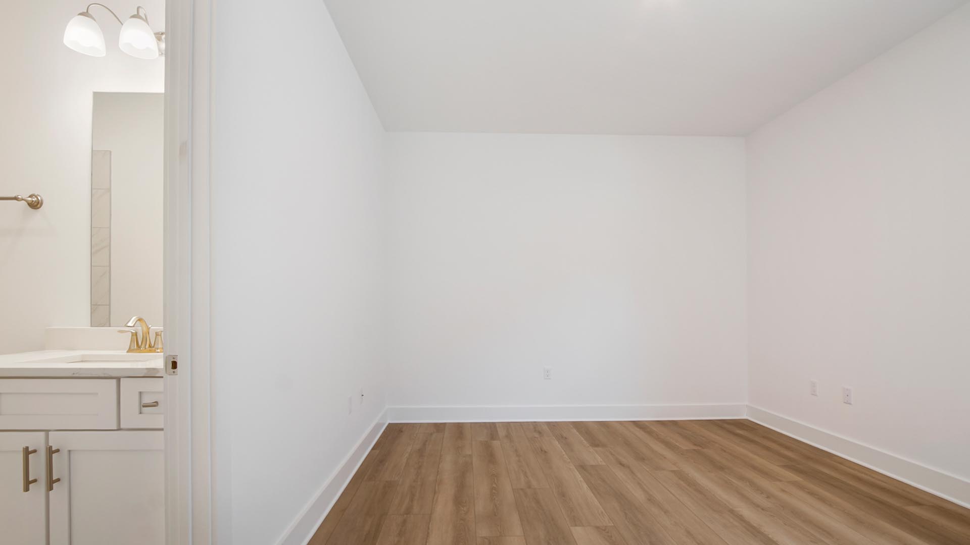 Bedroom four features EVP flooring and a private bathroom