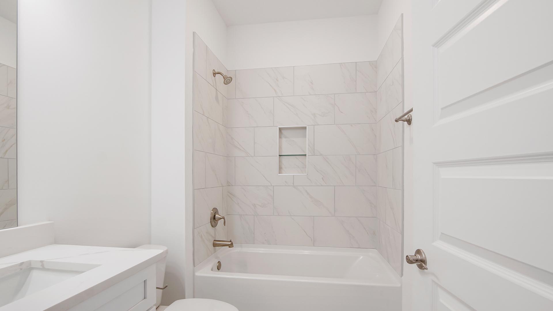 Full shower tub combination with tile wall