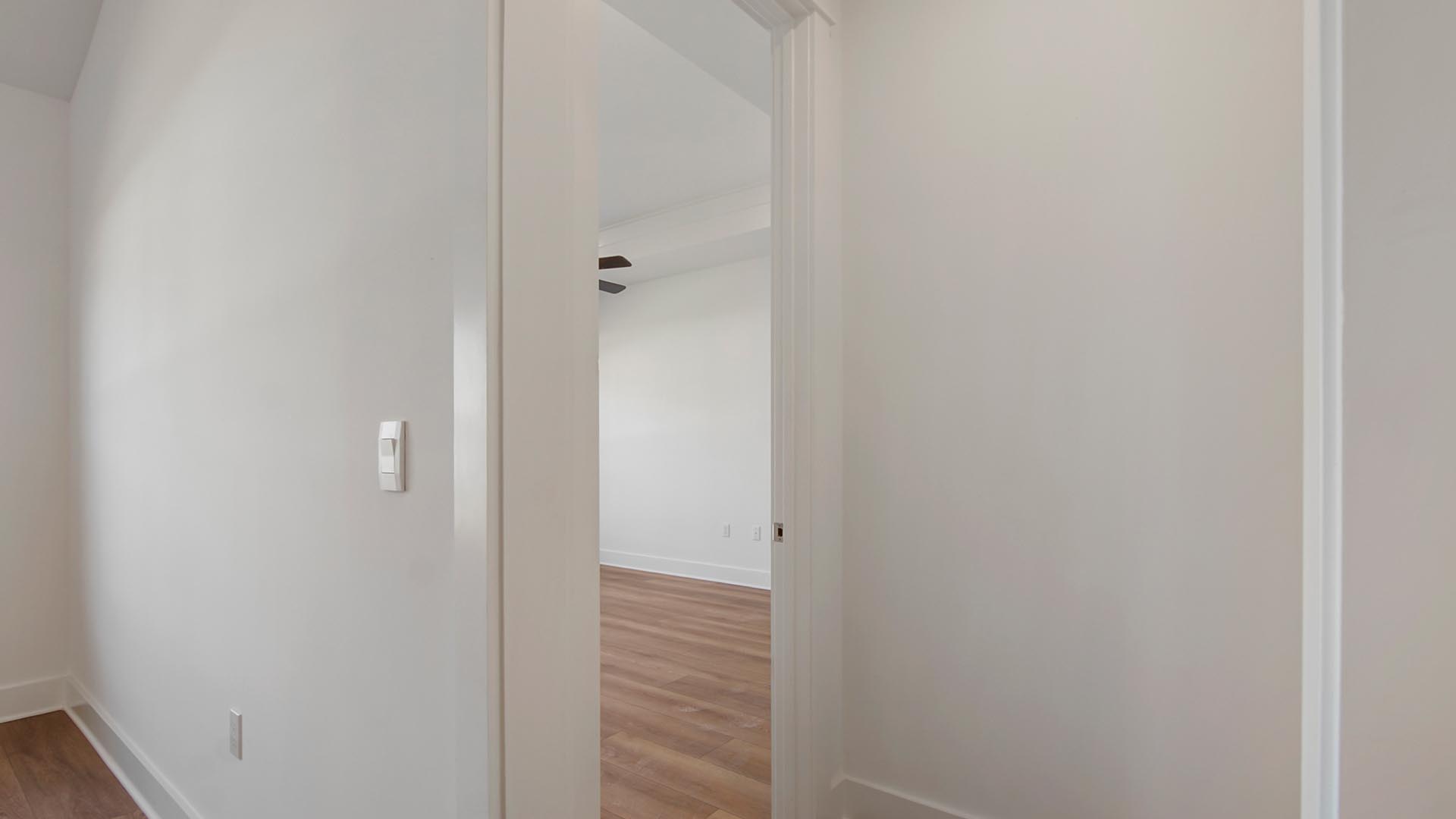 The primary bedroom is accessible from the living area