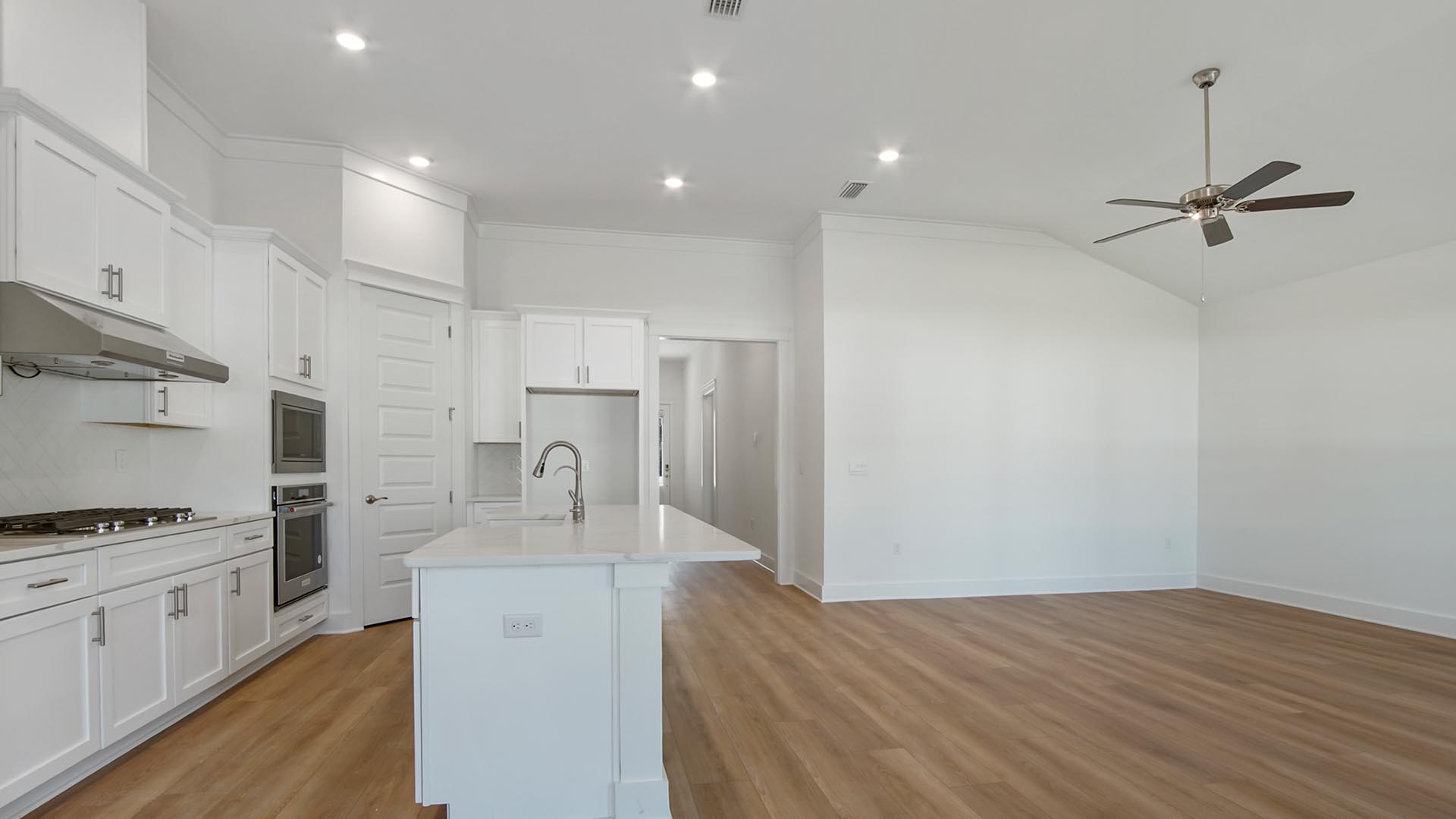 The grand living space and the center island offer interacting with guest and family from all areas