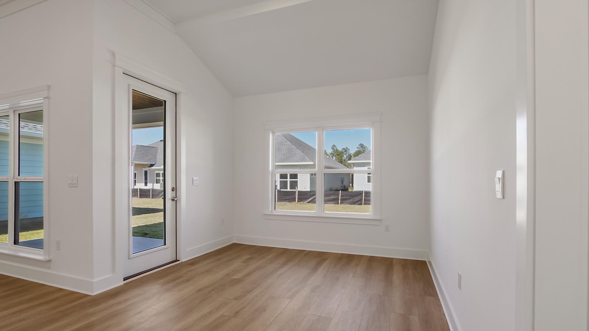 The covered back patio is accessible from the dining area