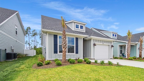 Breakfast Point Seaside plan front of two story home with large window and one car garage and covered front entrance.