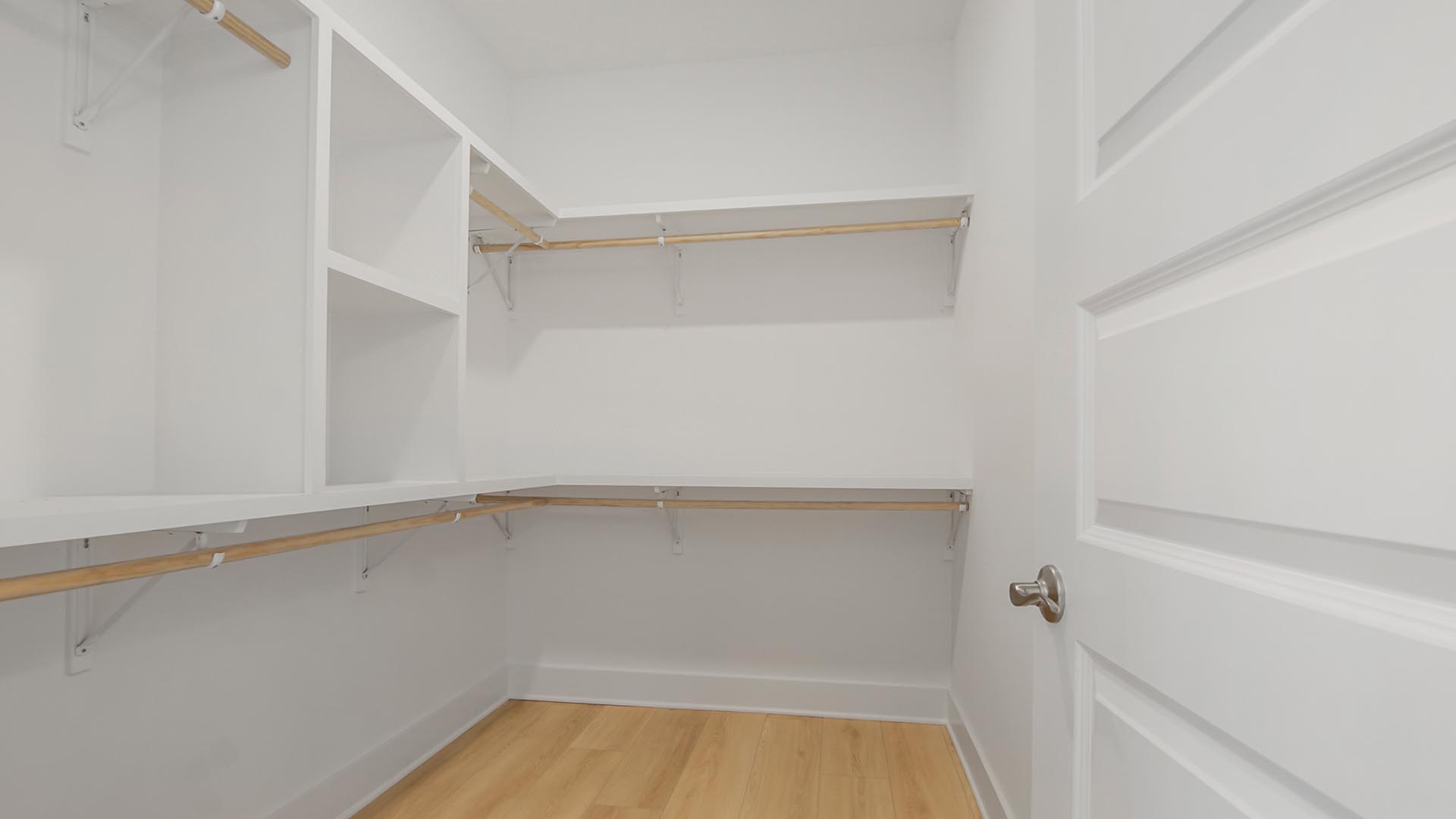 The closet in the primary bathroom is spacious