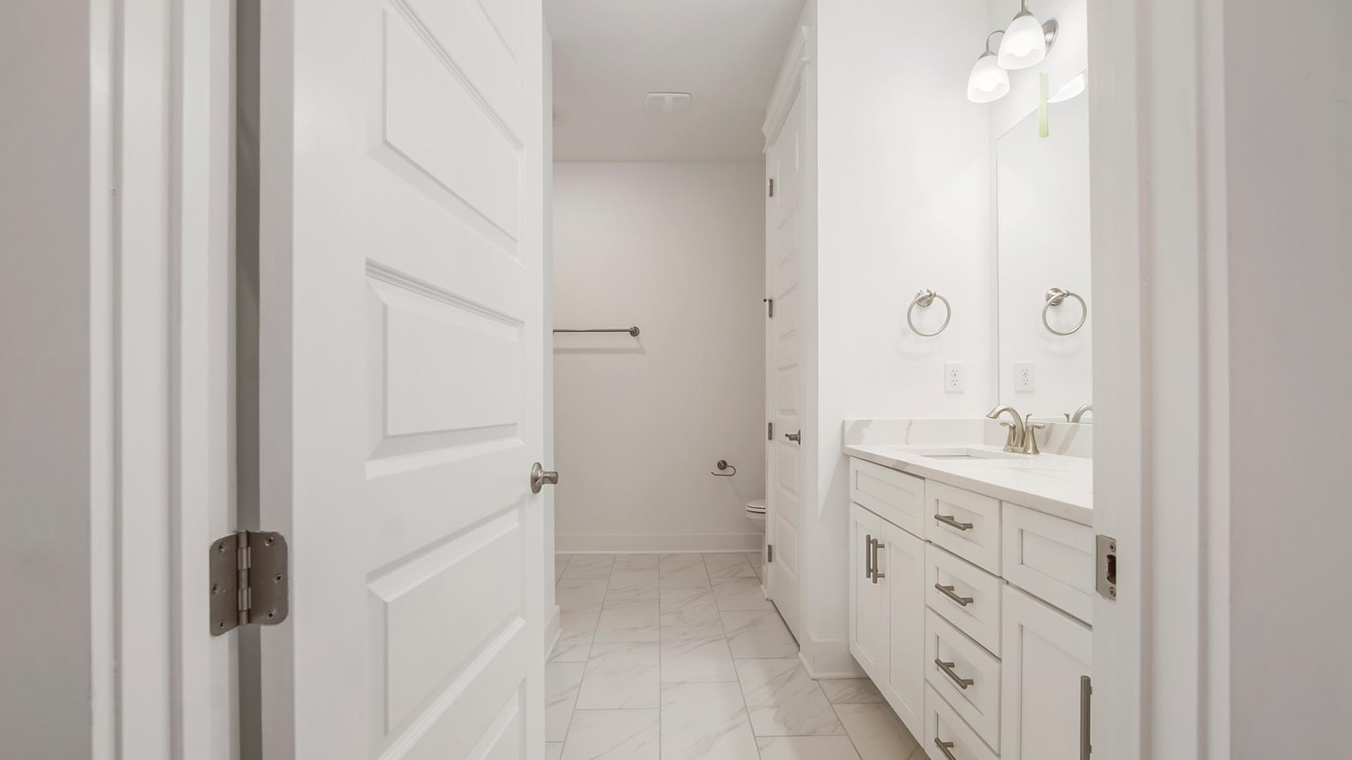 Spacious full bath with lower cabinetry and drawer for storage