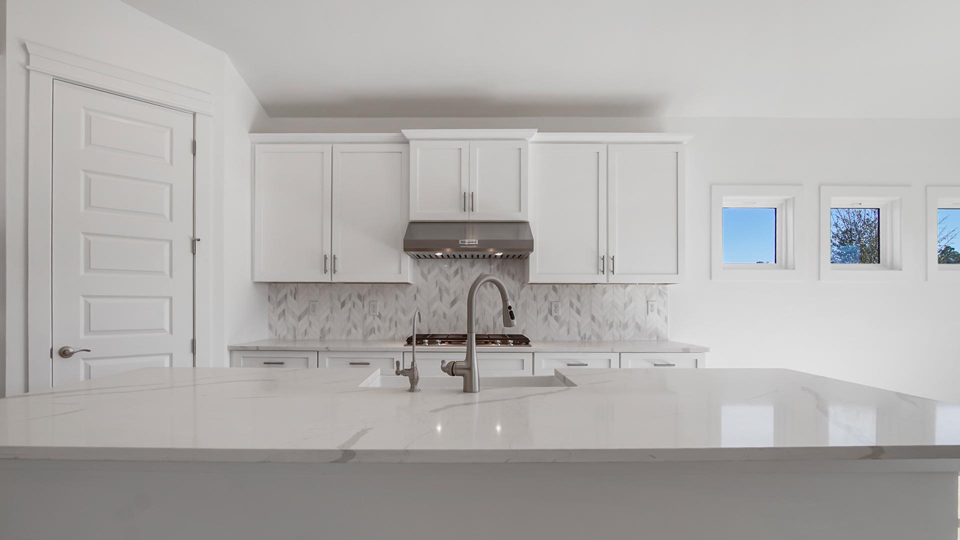 Kitchen with quartz countertops and a center island