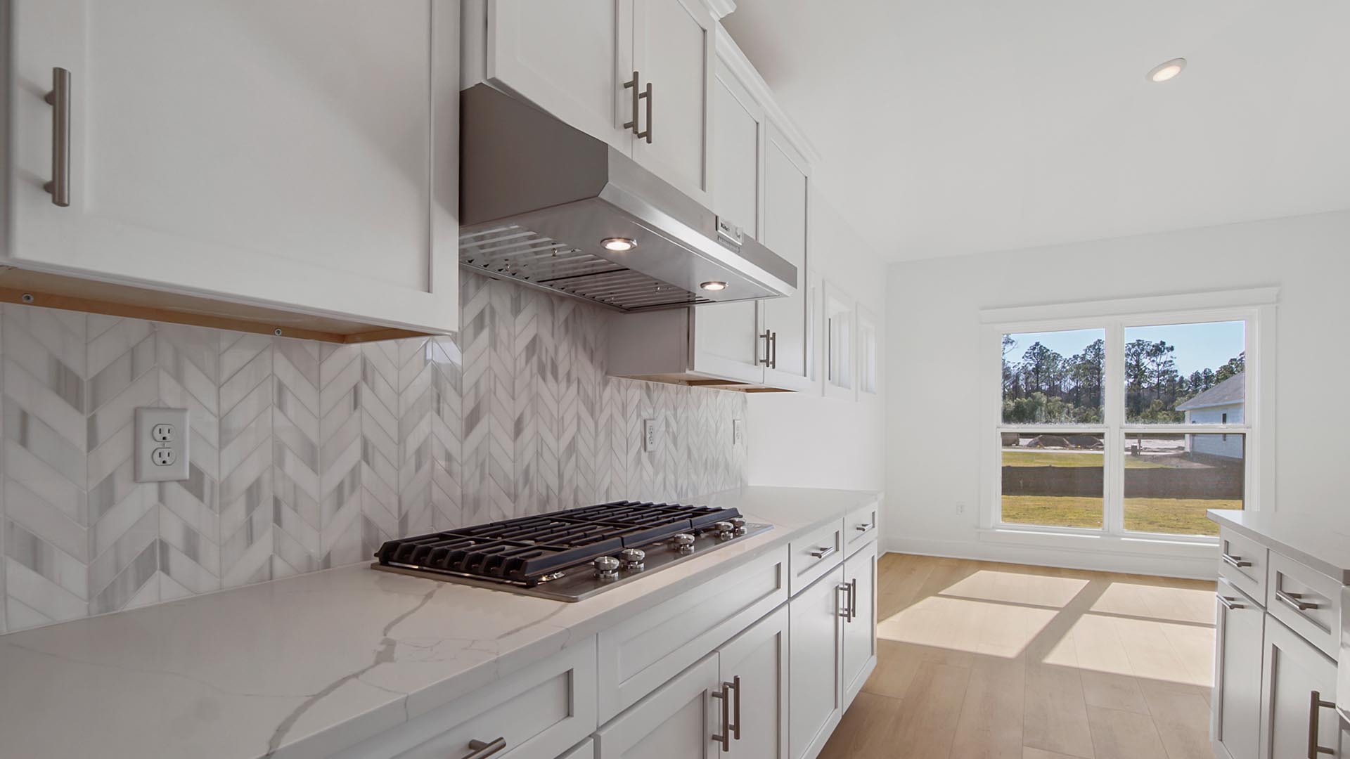 Beautiful backsplash with gas cooktop stove.