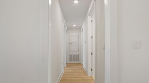 Hall leading to guest bedrooms