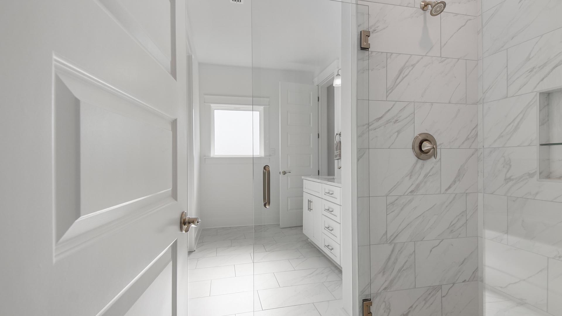 Step into the luxurious primary bathroom with tile flooring shower and separate tub