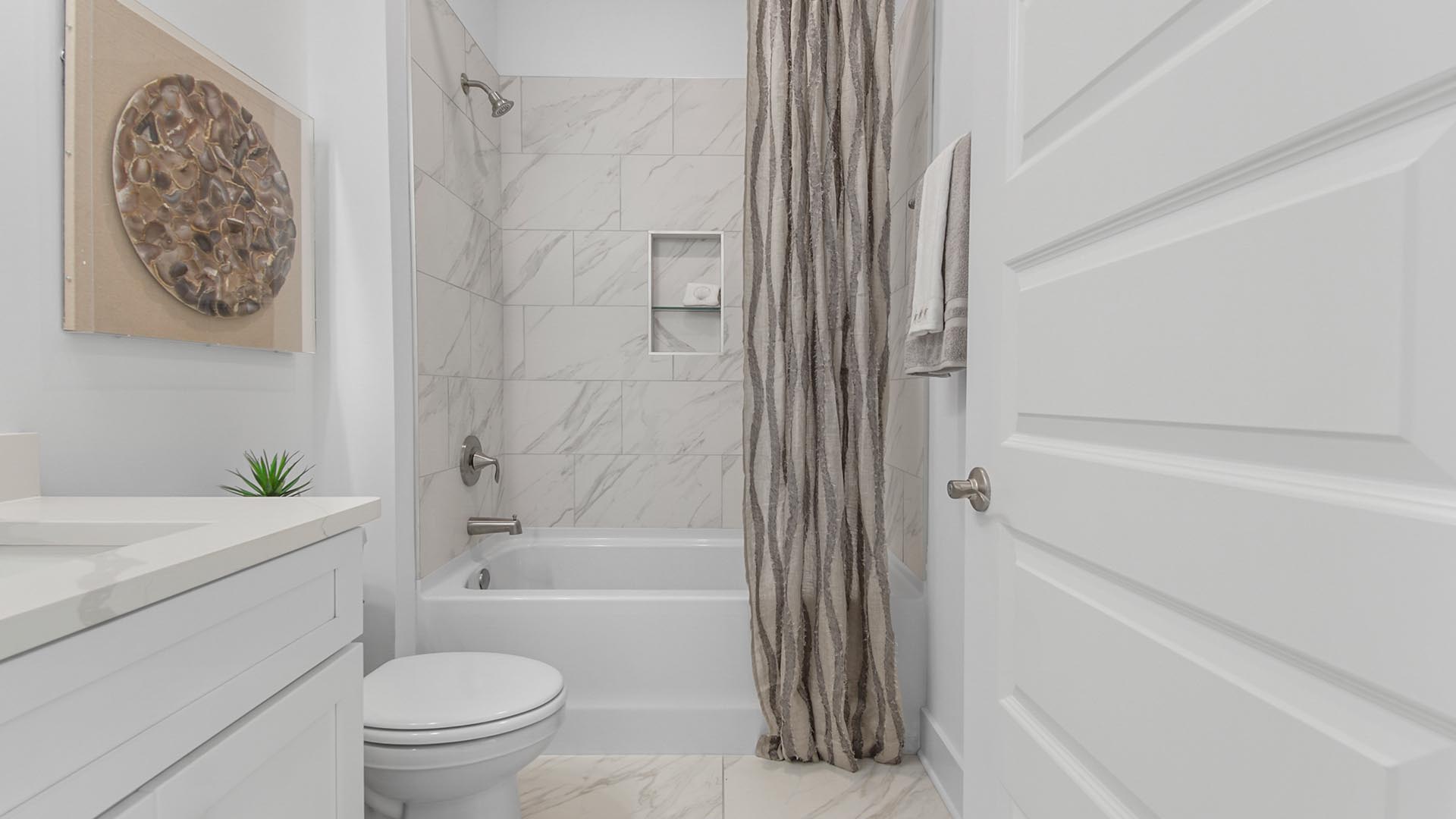 The shared bathroom is located between bedrooms two and three and features a shower and tub combination