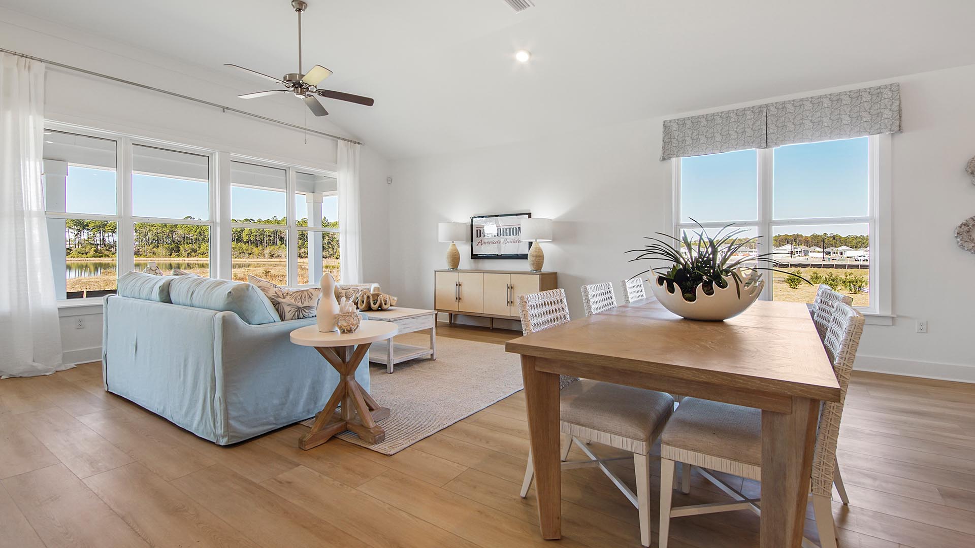 The living area features expansive windows designed to allow for natural light