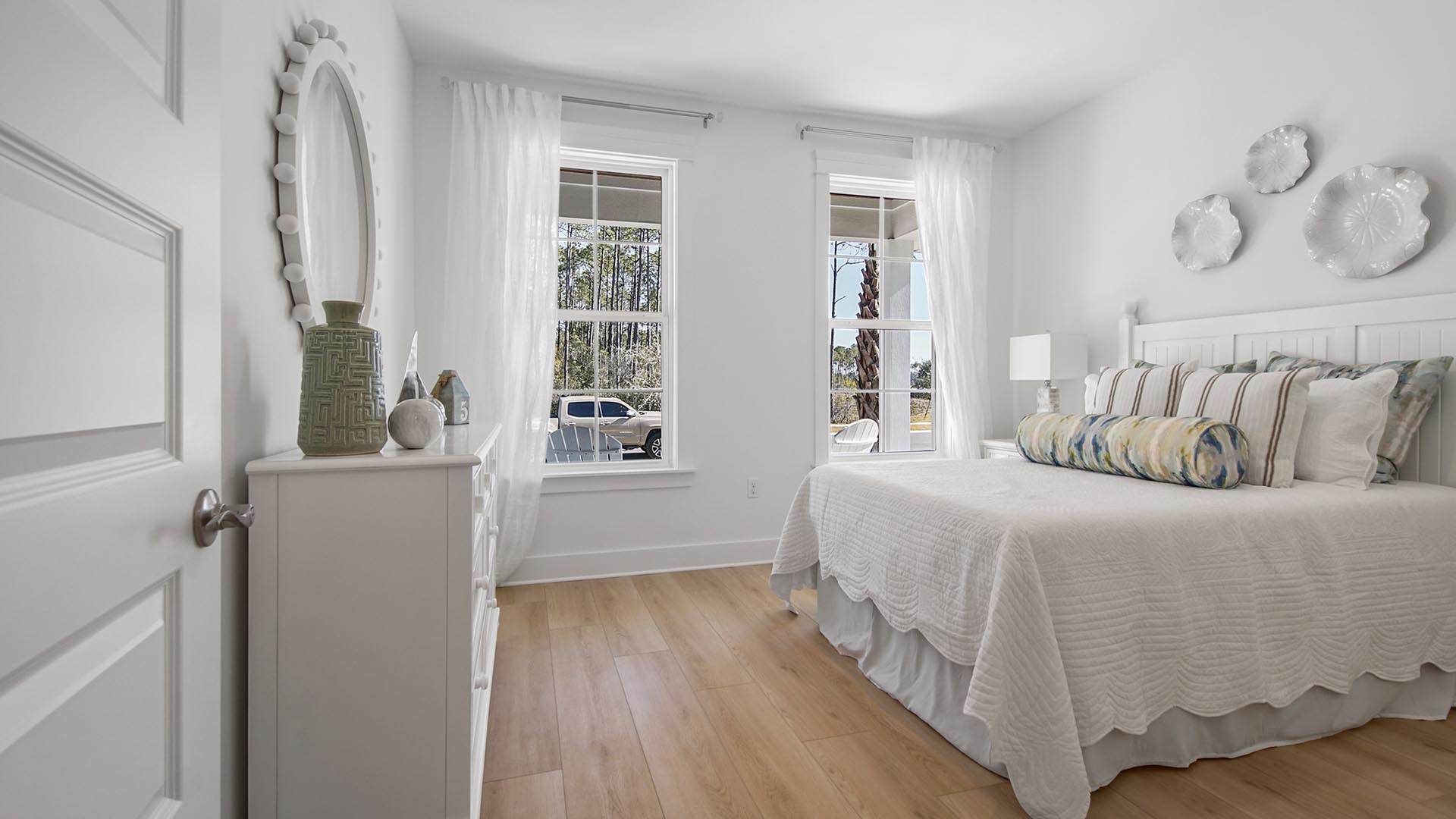 Bedroom three overlooks the front lawn with windows allowing for natural light