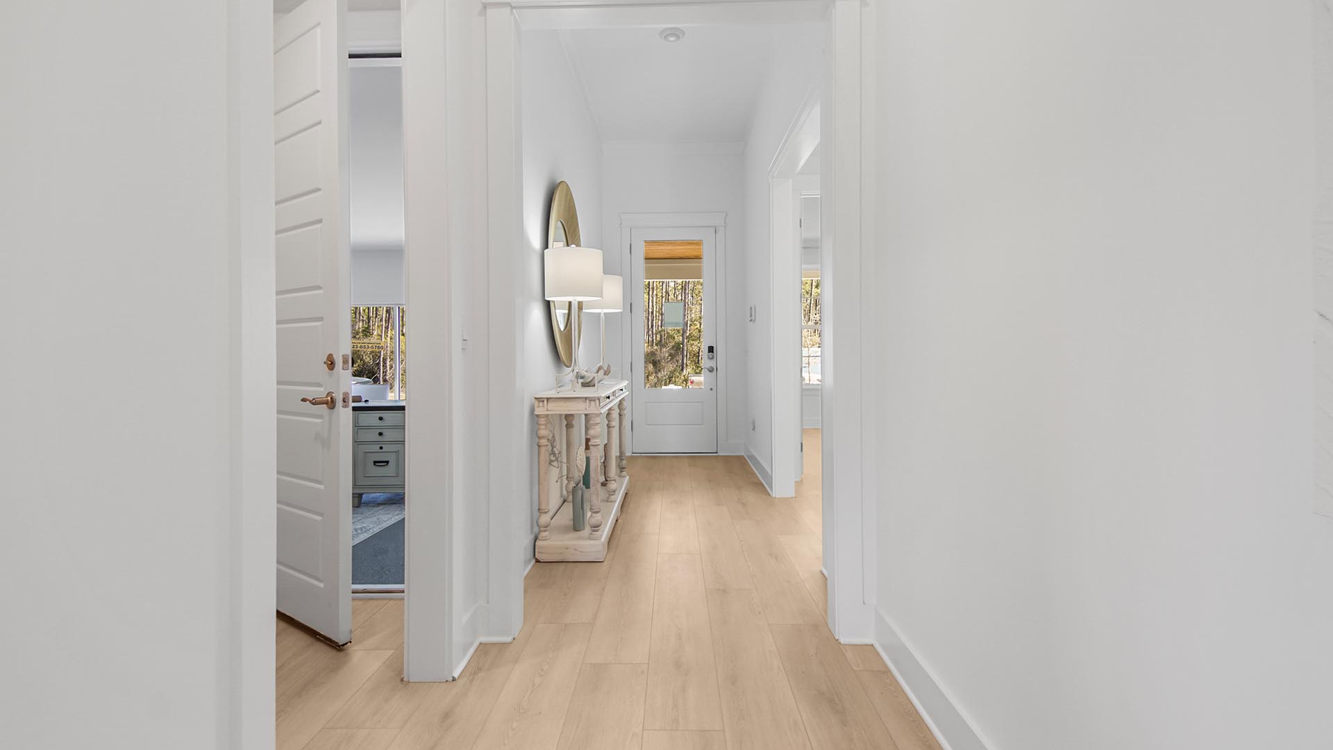 The entry hall has two additional bedrooms and a shared bath and leads to the open concept design living area