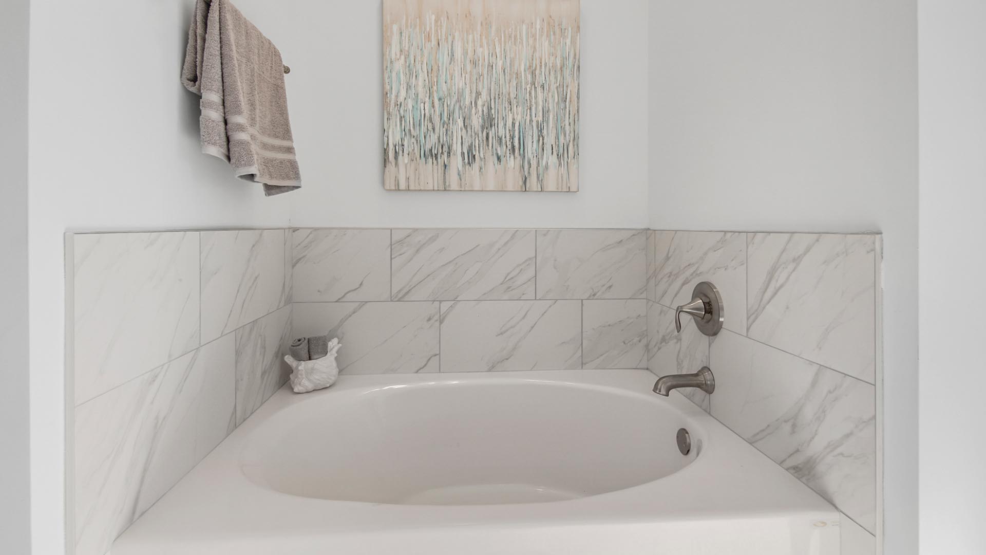 The luxurious soak tub in the primary bathroom