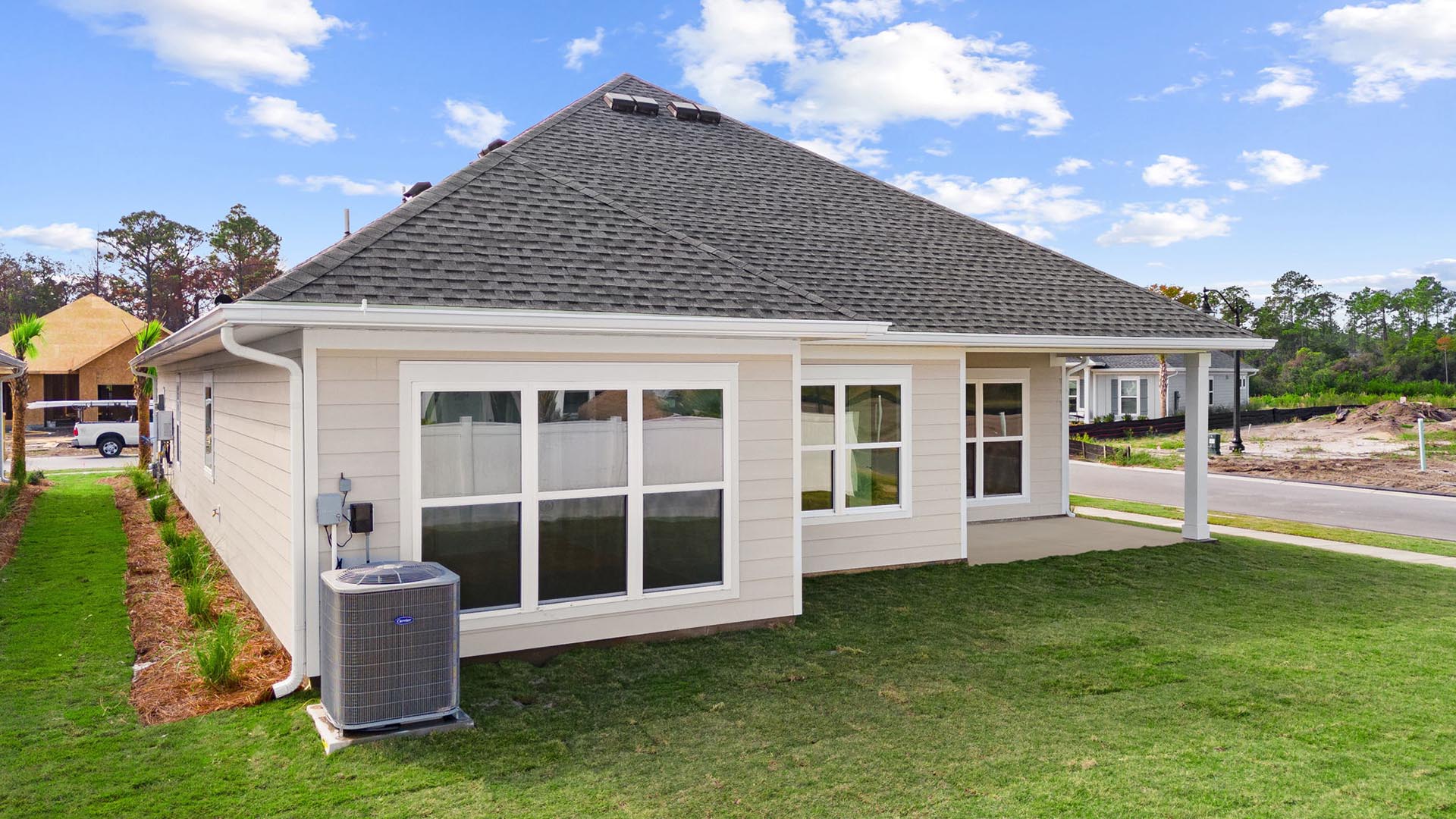 Expansive windows at the back of the home allow for natural light