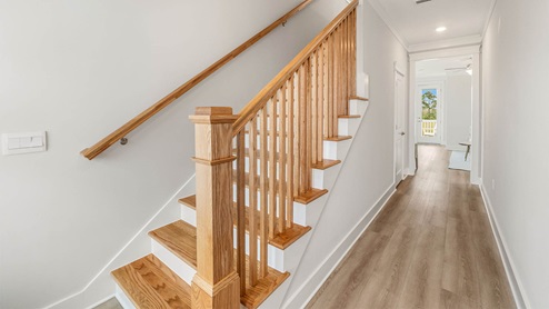 Foyer with wooden staircase.