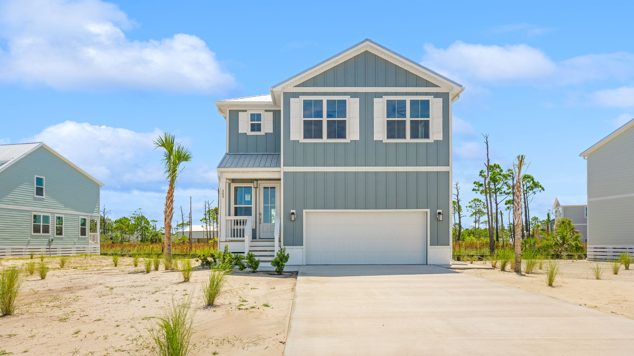 Key Largo floor plan at Redfish Cove with two car garage and covered front porch.
