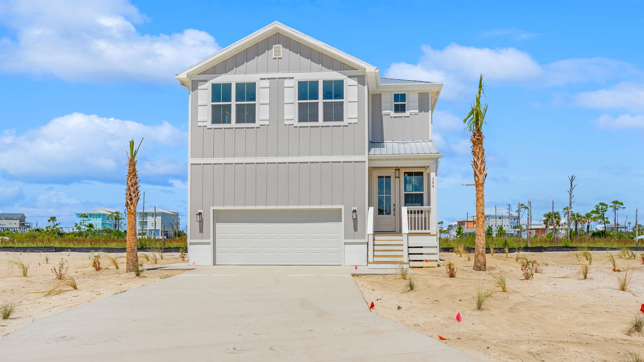 Key Largo floor plan at Redfish Cove with two car garage and covered front porch.